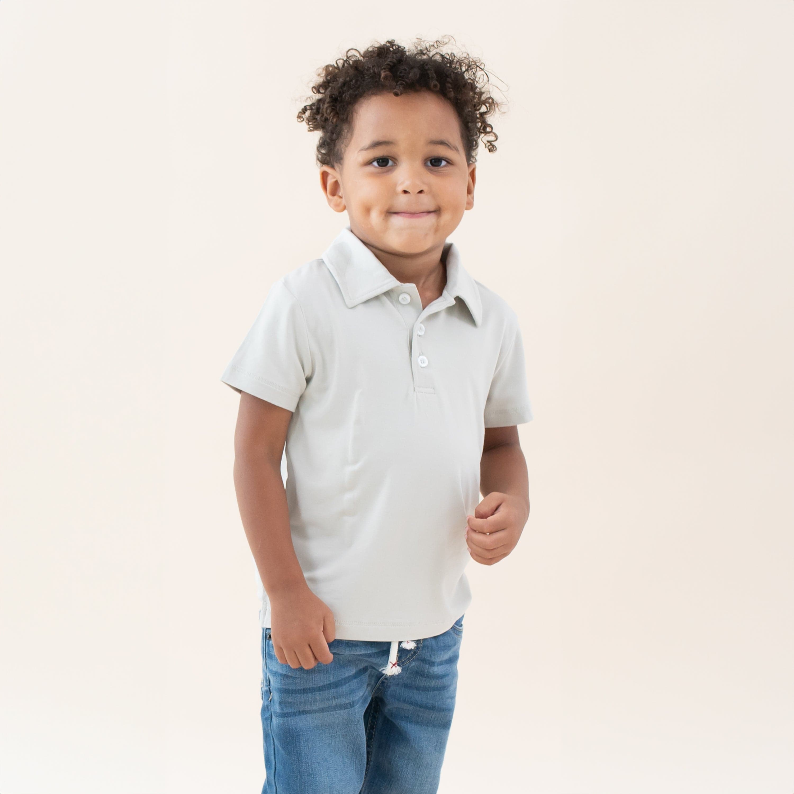 Toddler wearing Kyte Baby Short Sleeve Shirt with Polo Collar in Oat