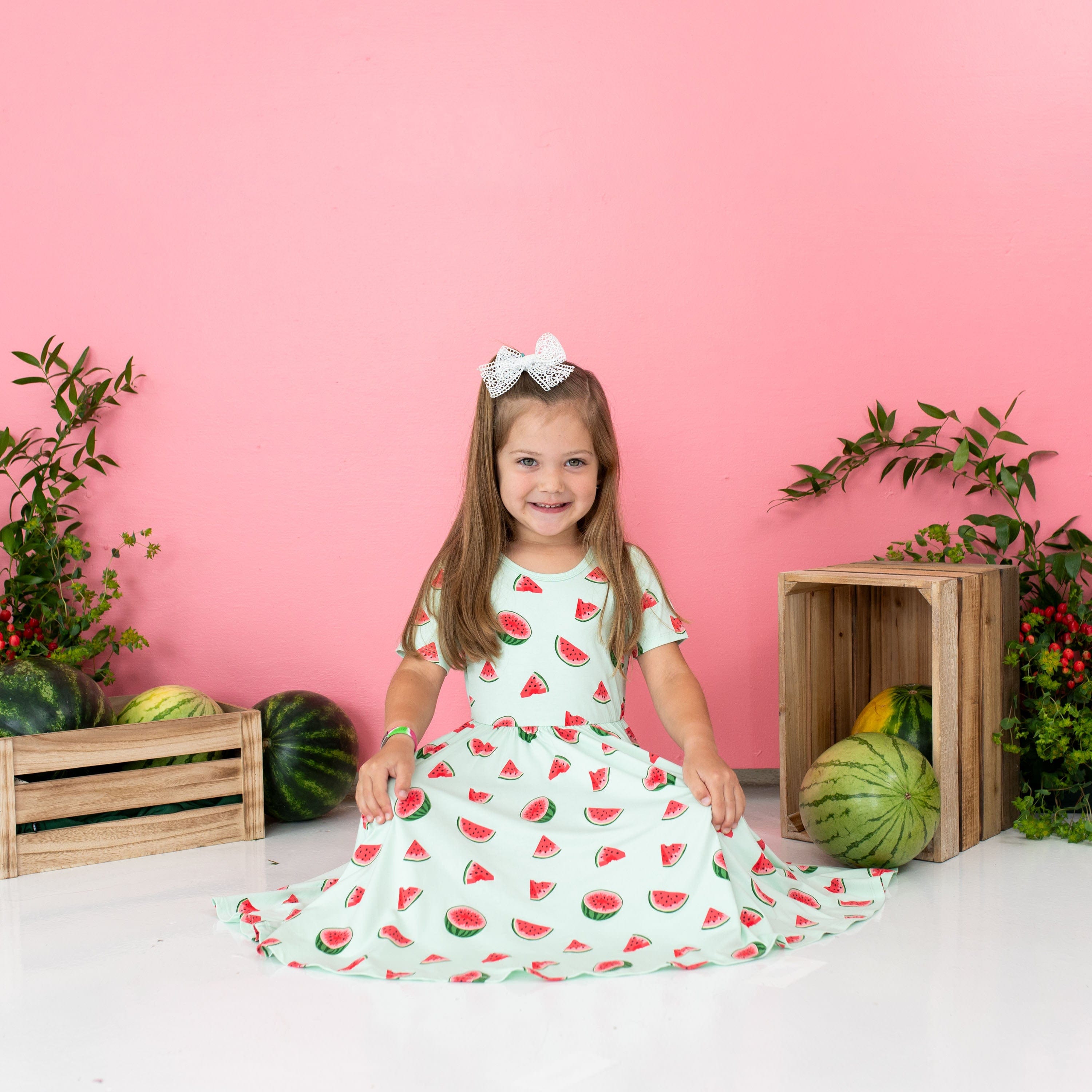 Toddler Girl wearing Kyte Baby Bamboo Twirl Dress in Watermelon