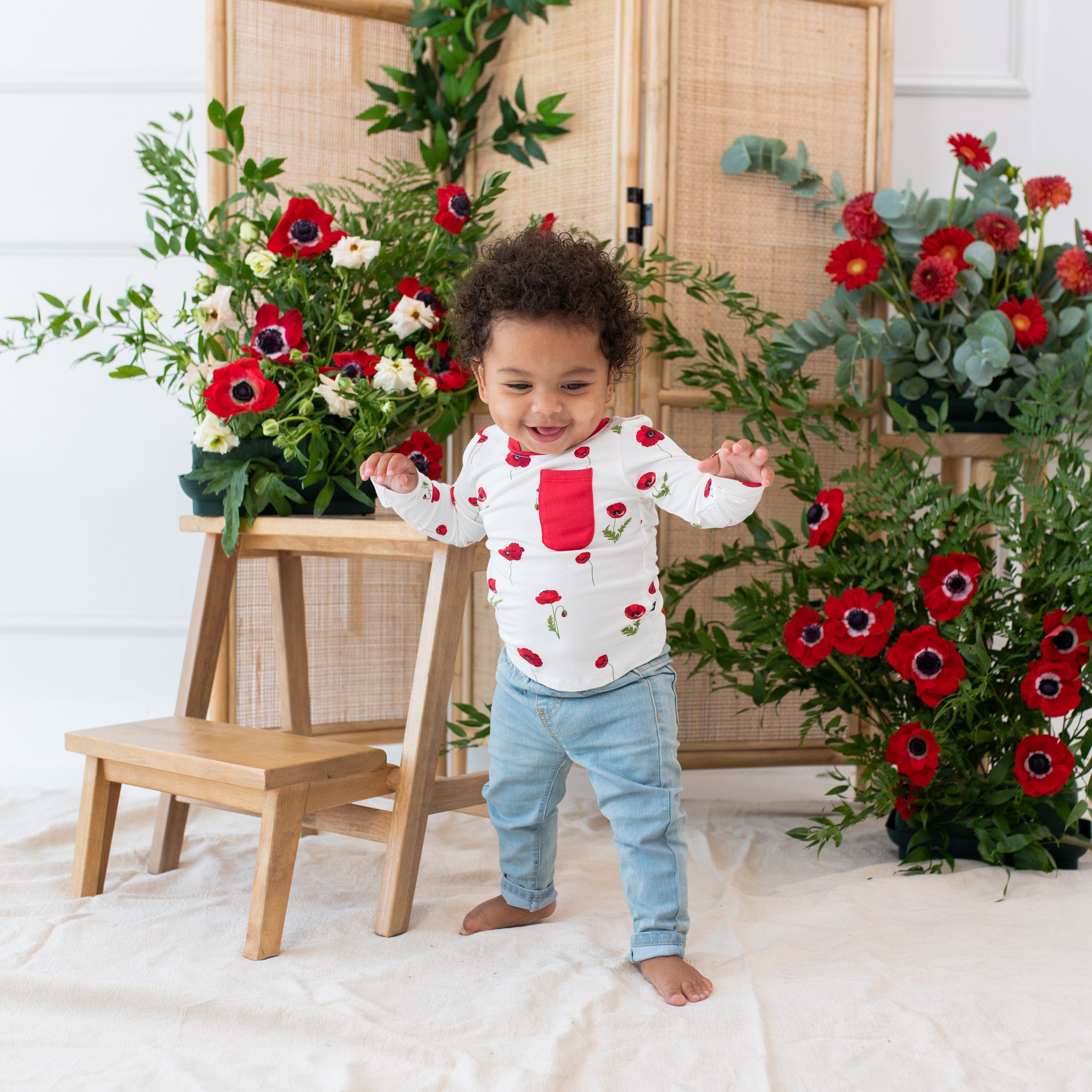 Toddler wearing Kyte Baby Long Sleeve Crew Neck Tee in Cloud Poppies