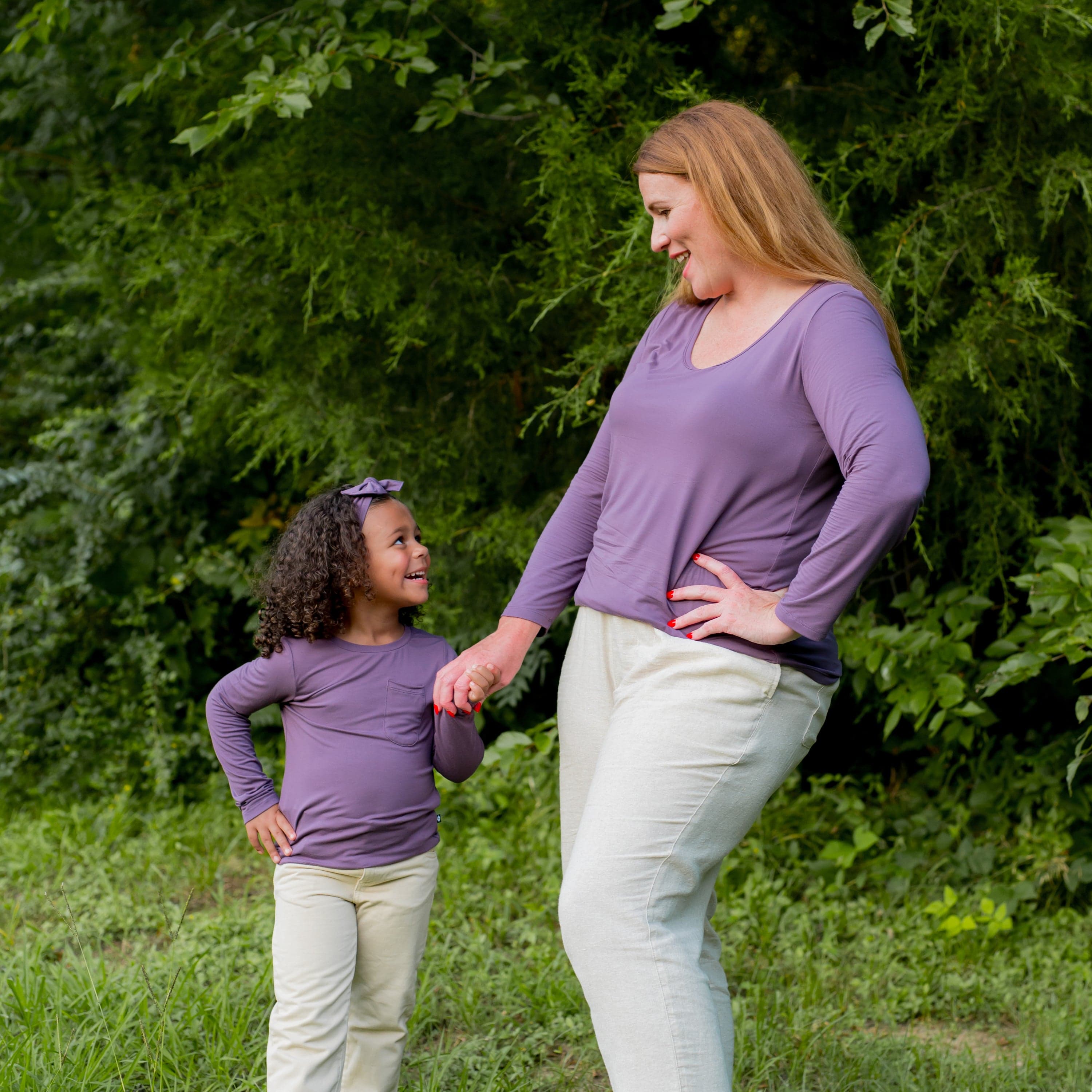 Mom with Toddler wearing matching Kyte Baby Long Sleeve Tees in Currant