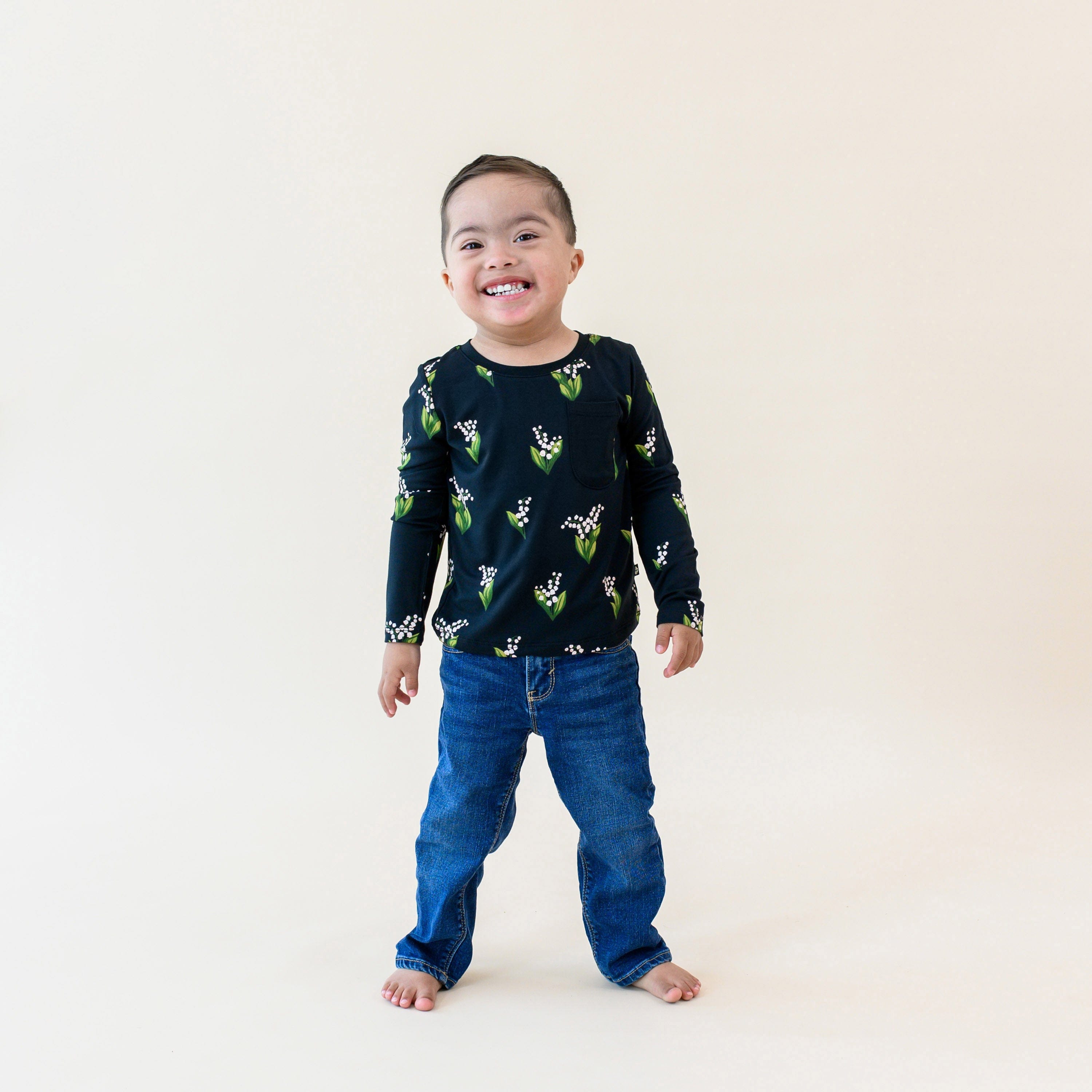 Toddler wearing Kyte Baby Long Sleeve Crew Neck Tee in Midnight Lily