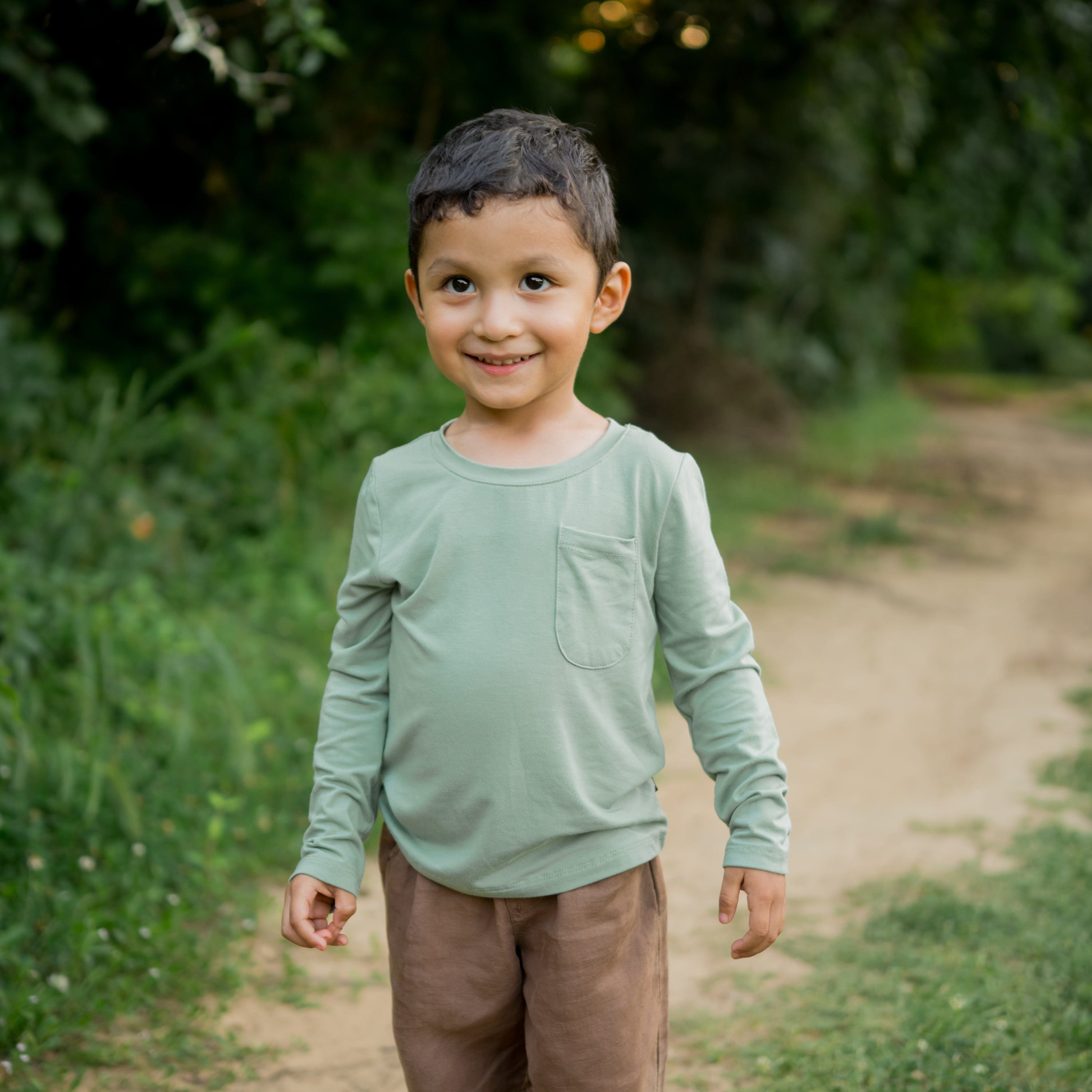 Toddler wearing Kyte Baby Long Sleeve Crew Neck Tee in Thyme