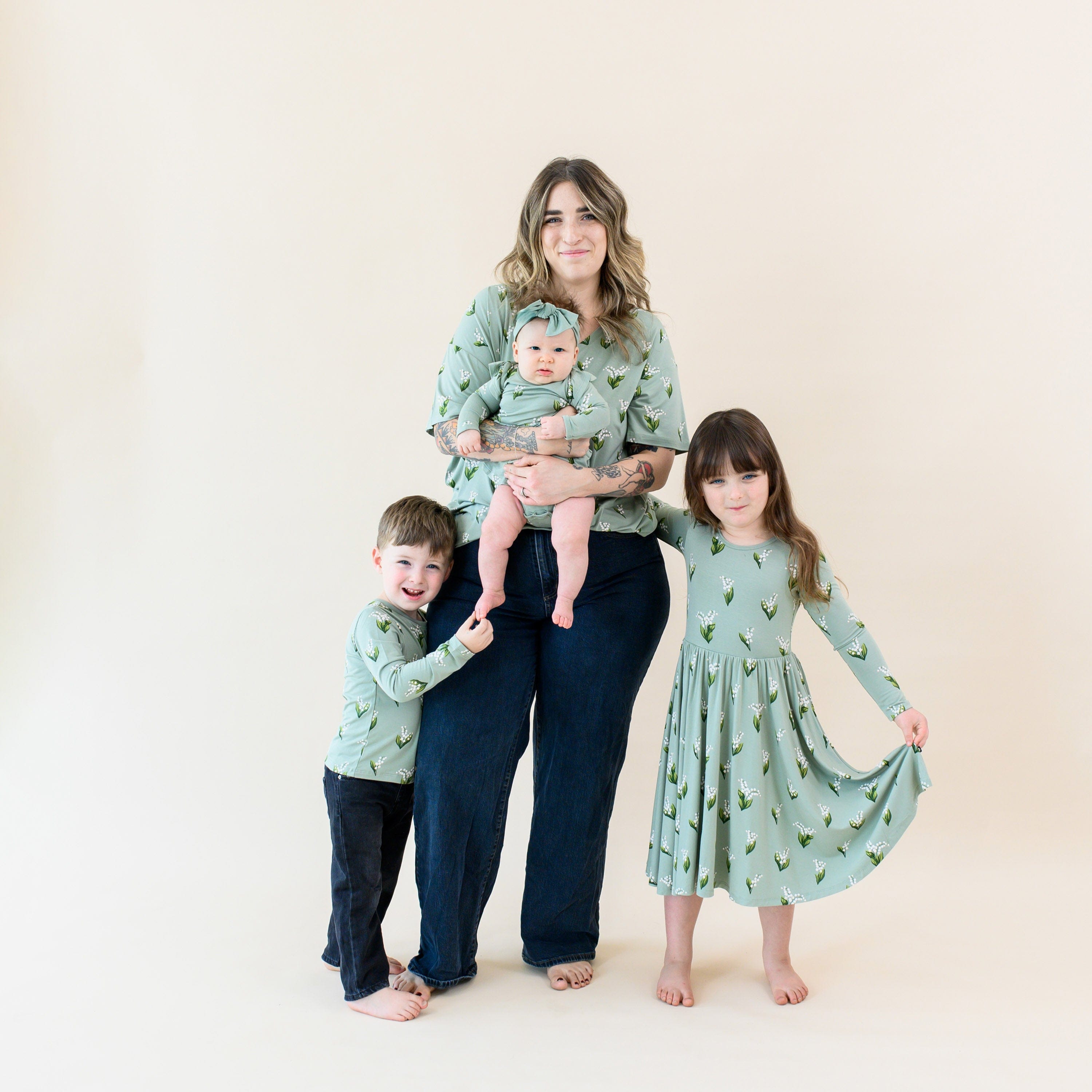 Family wearing matching Kyte Baby bamboo clothing in Thyme Lily print