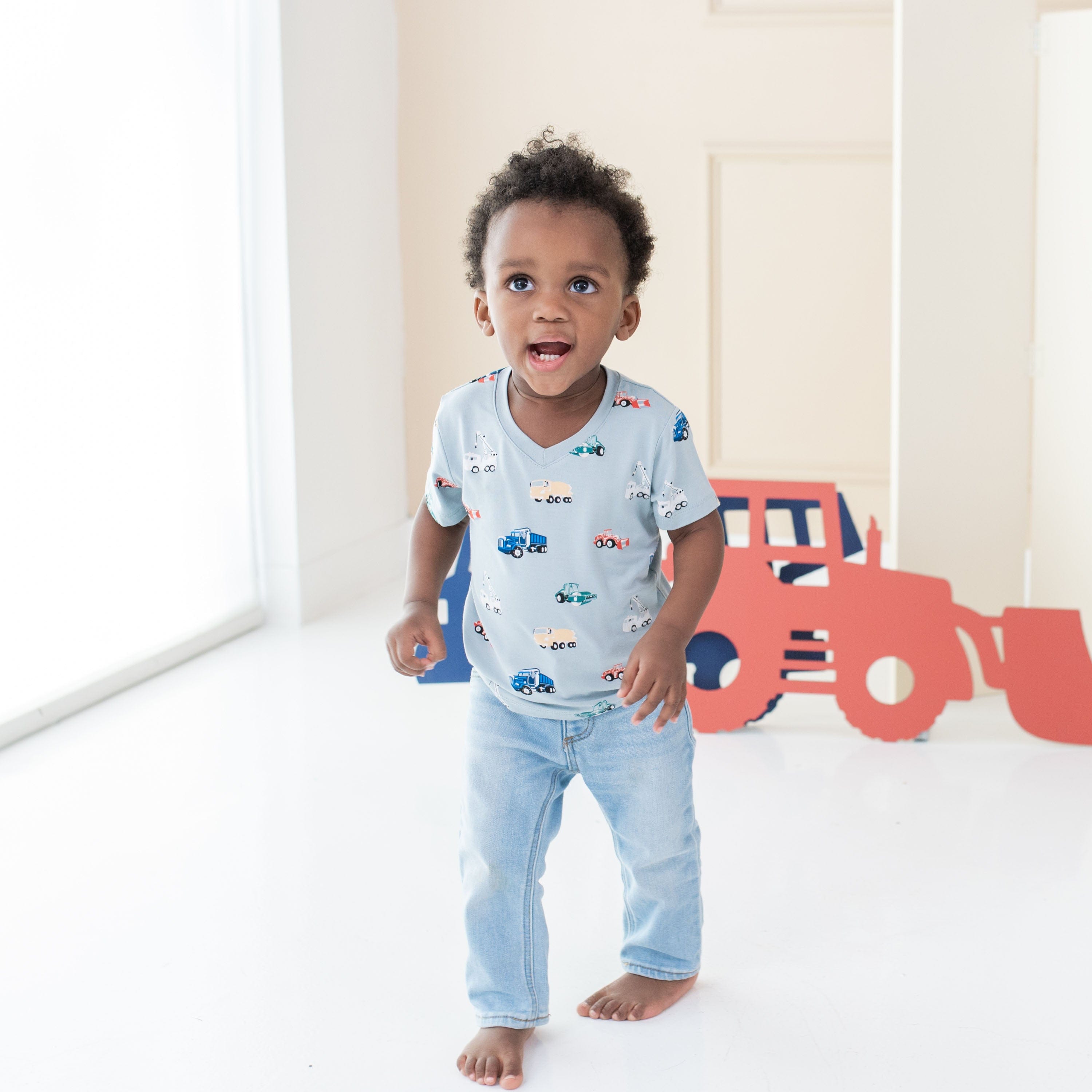 Boy wearing Kyte Baby Toddler V-Neck Tee in Construction