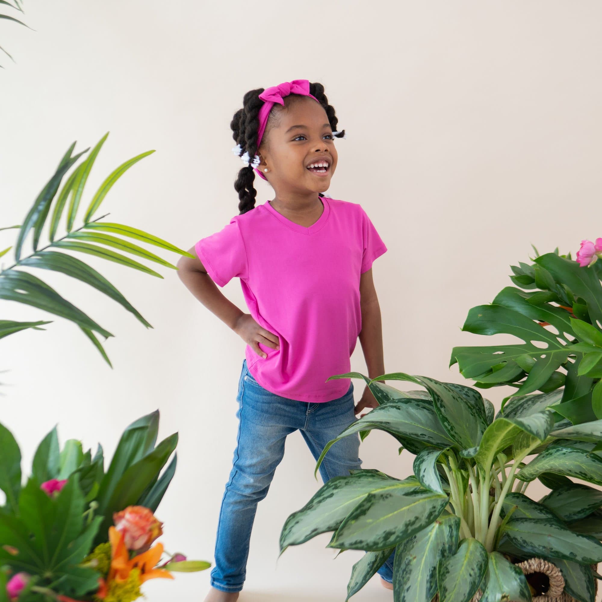 Child wearing Kyte Baby Toddler relaxed fit V-Neck Tee in Raspberry pink