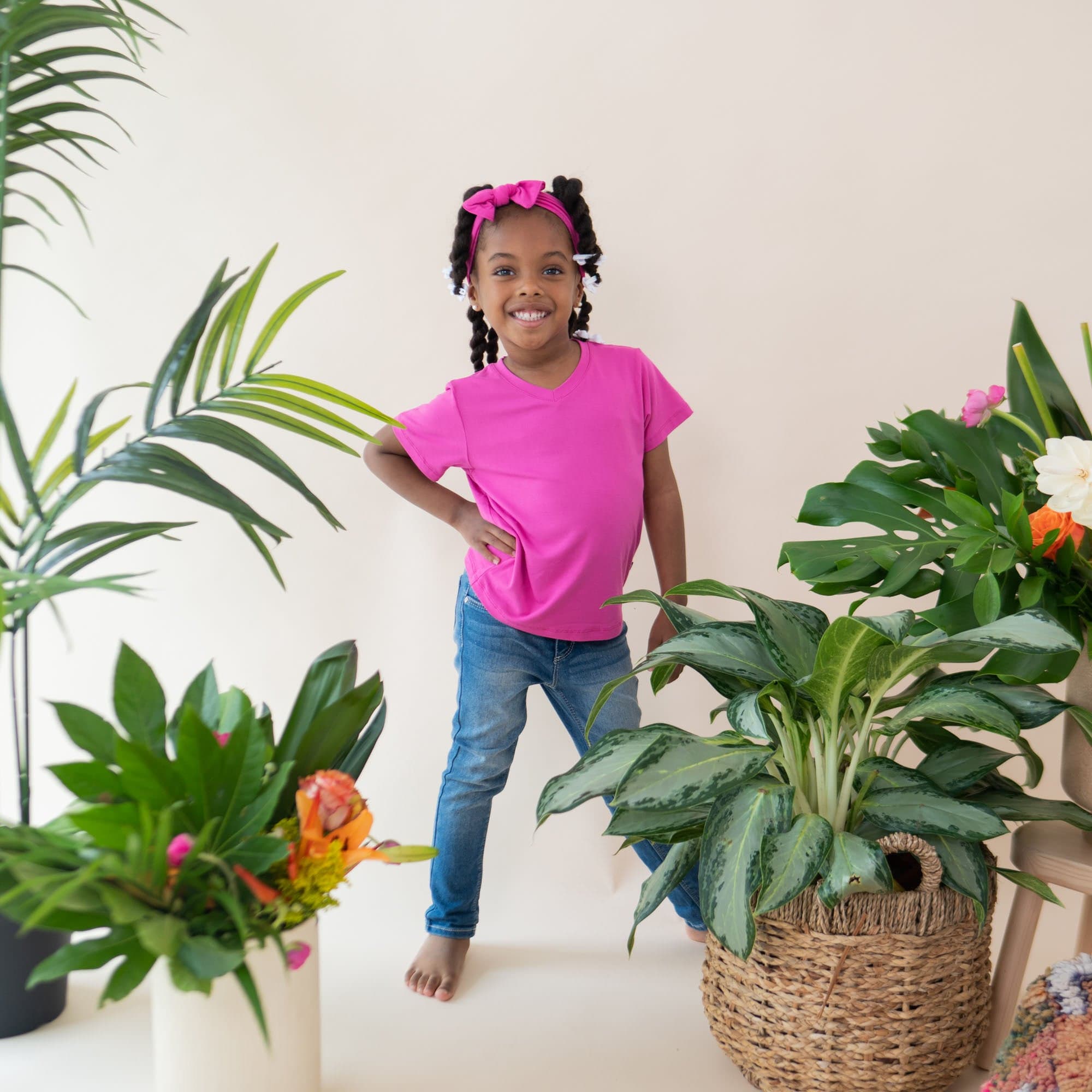 Girl wearing Kyte Baby Toddler V-Neck Tee in Raspberry