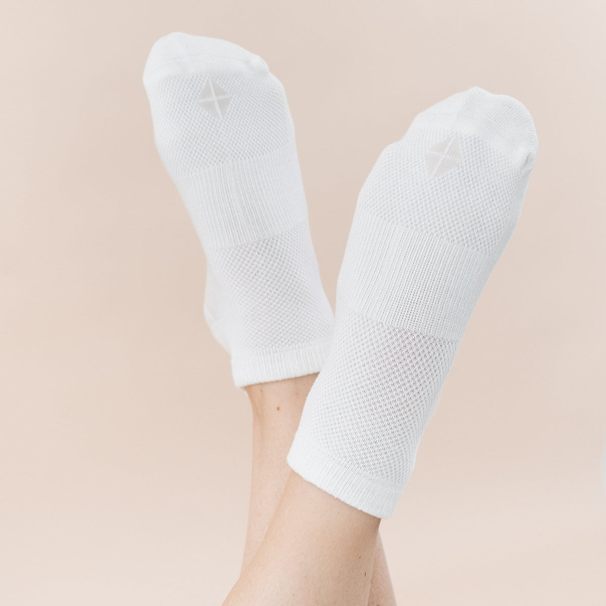 Woman wearing Kyte Baby Women's Ankle Socks in Cloud