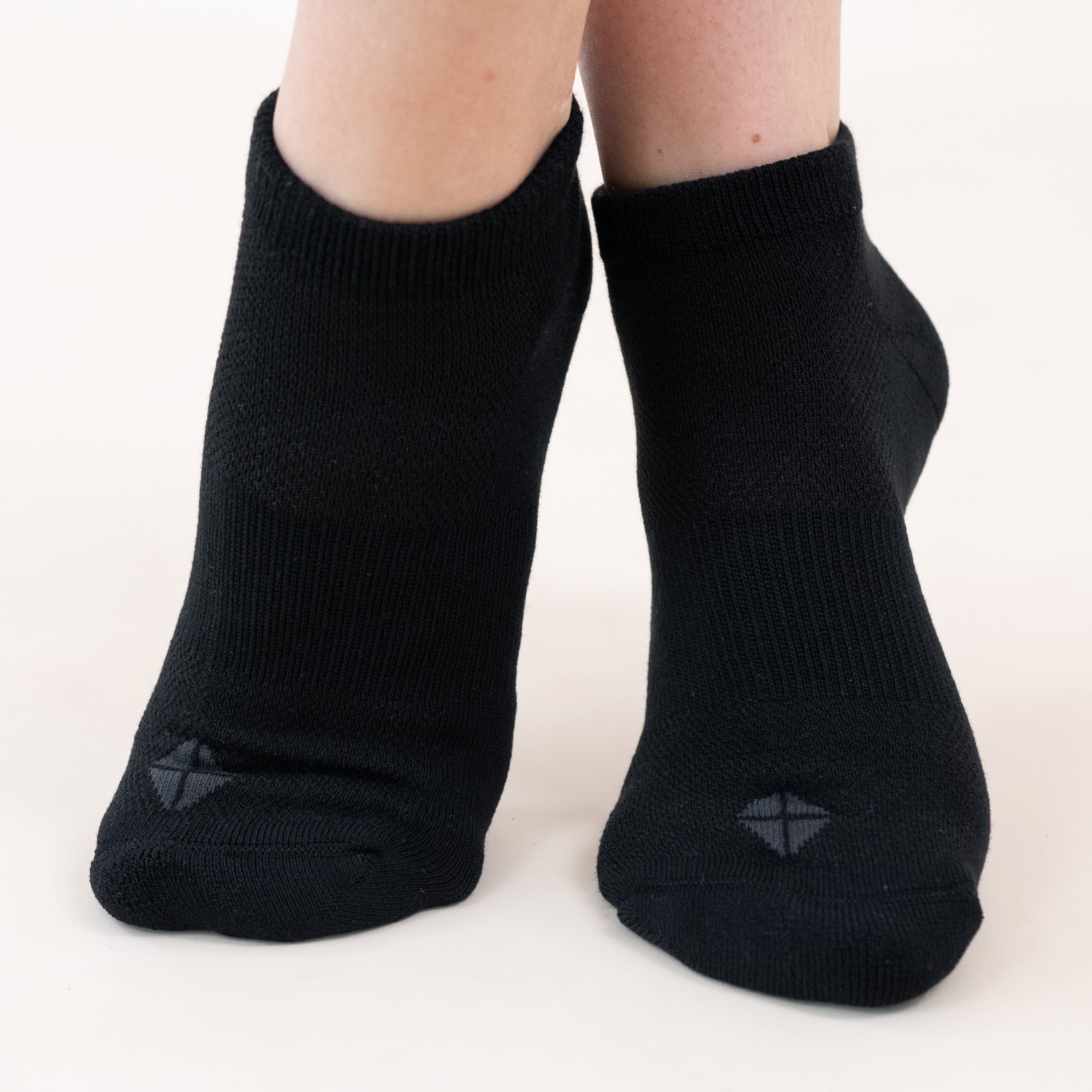 Woman wearing Kyte Baby Women's Ankle Socks in Midnight