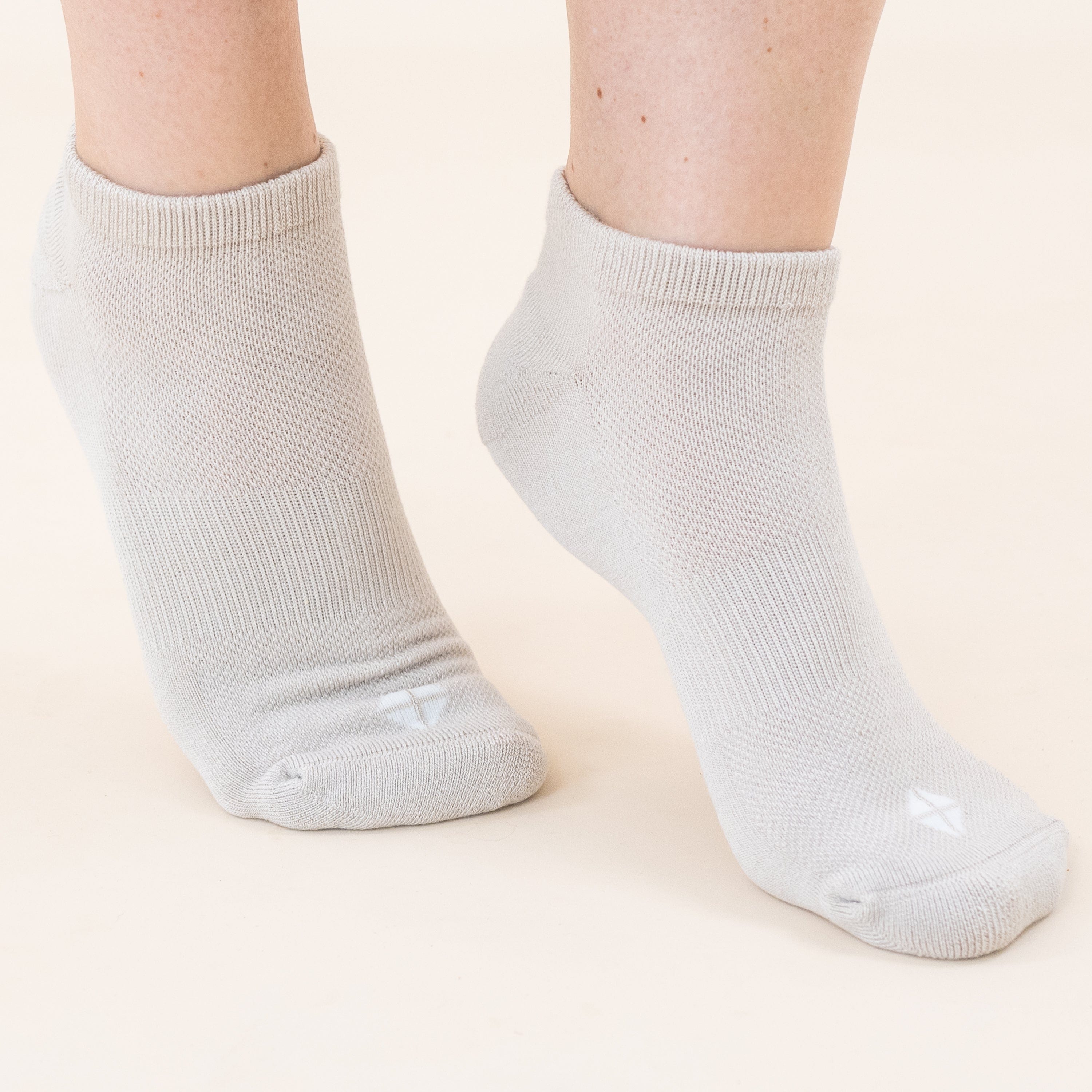Woman wearing Kyte Baby Women's Ankle Socks in Neutral