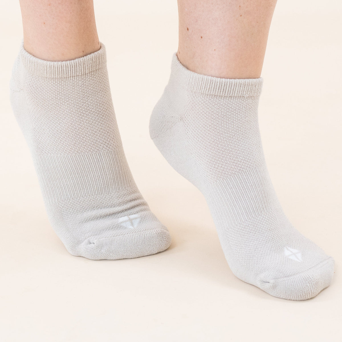 Woman wearing Kyte Baby Women's Ankle Socks in Neutral