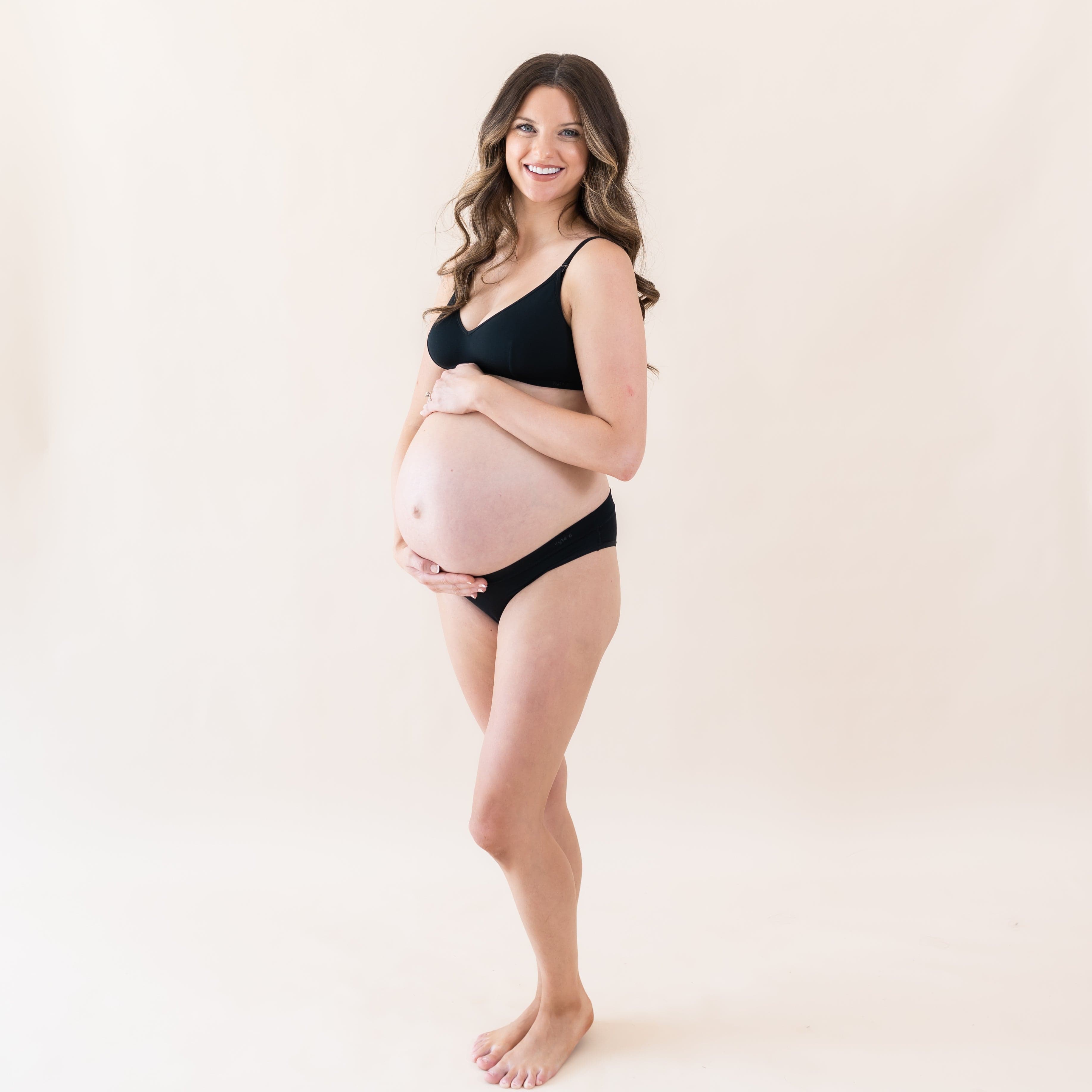 Pregnant woman wearing Kyte Baby Women's Cheekini Underwear in Midnight
