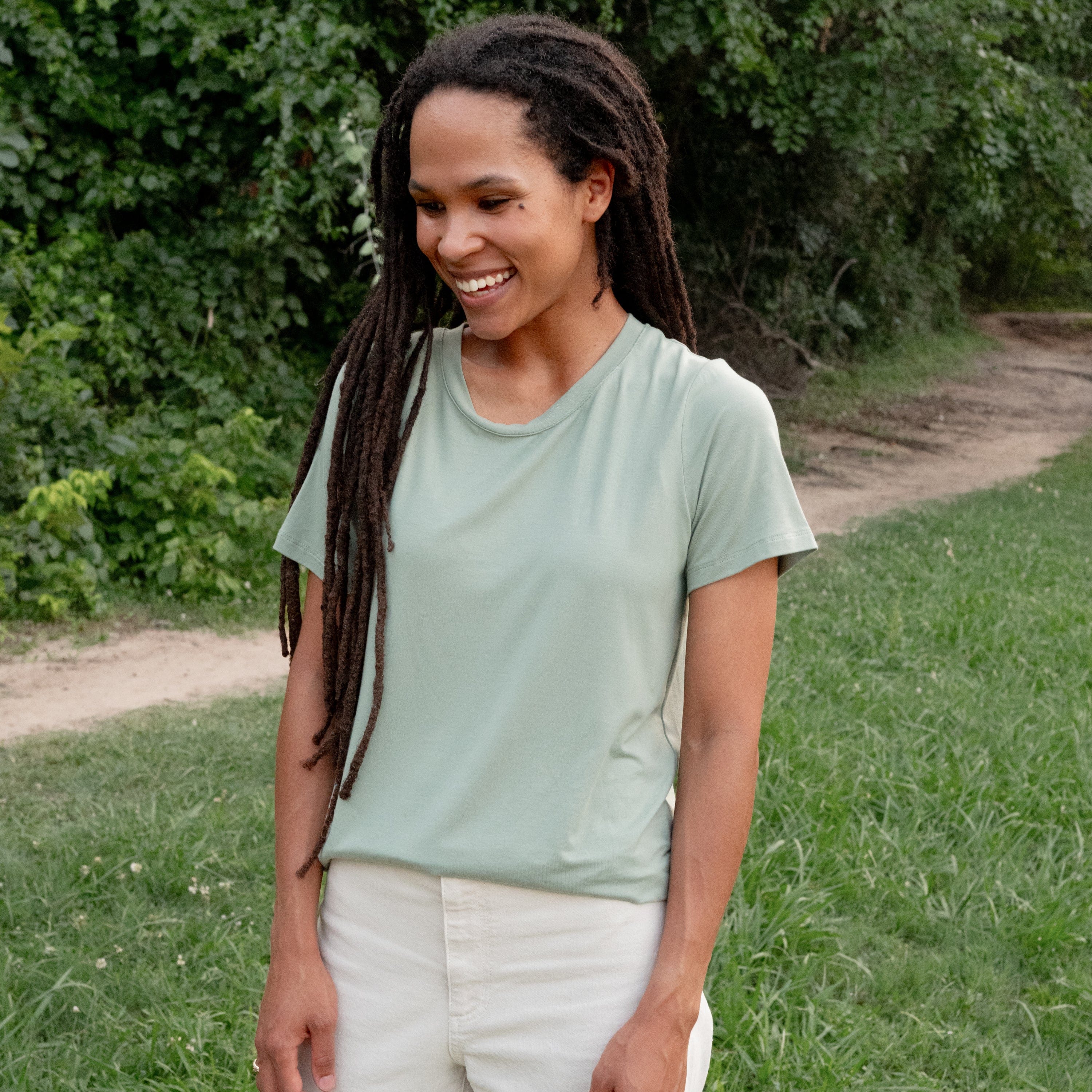 Woman wearing Kyte Baby Women's Crew Neck Tee in Thyme