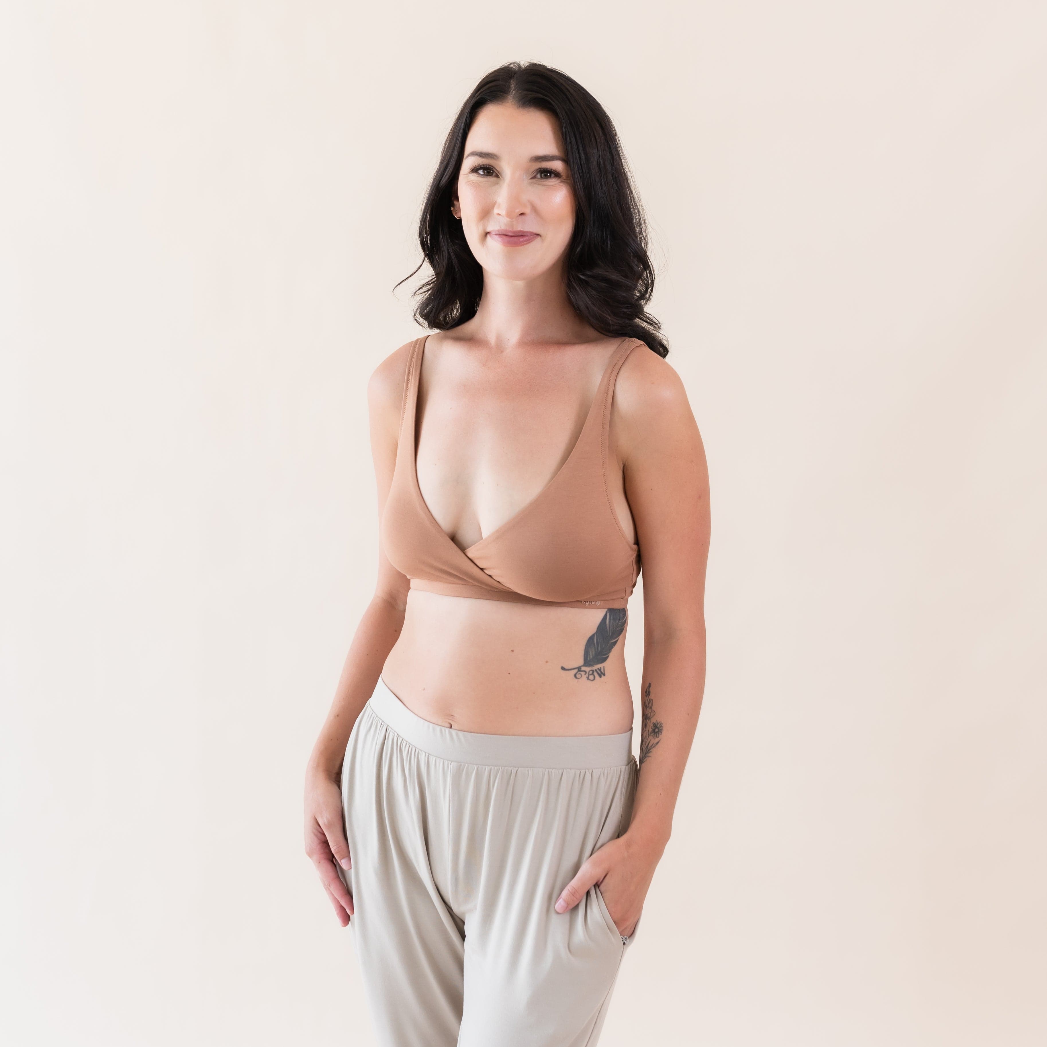 Woman wearing Kyte Baby Women's Cross Front Bralette in Latte