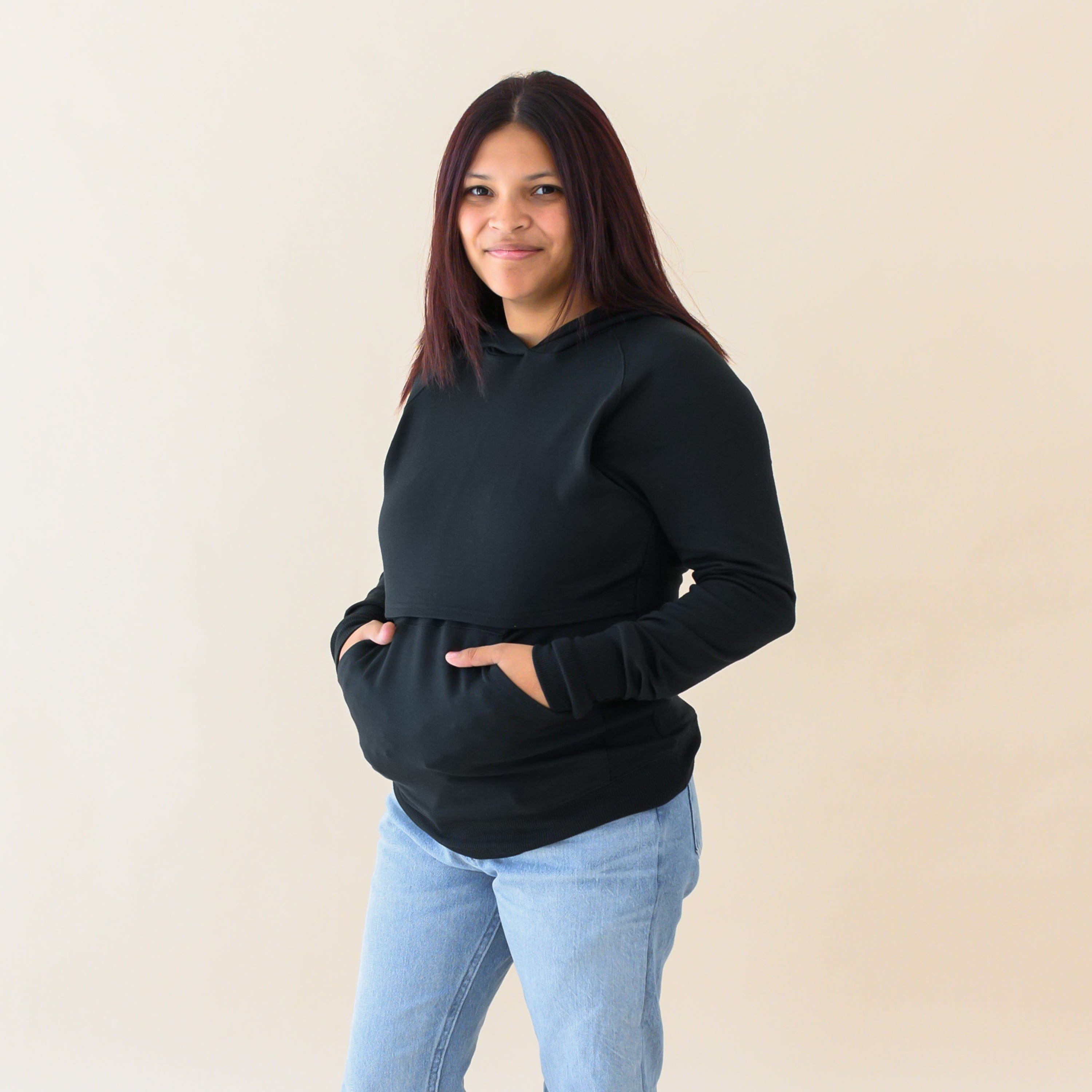 Woman wearing Kyte Baby Women's French Terry Nursing Hoodie in Midnight