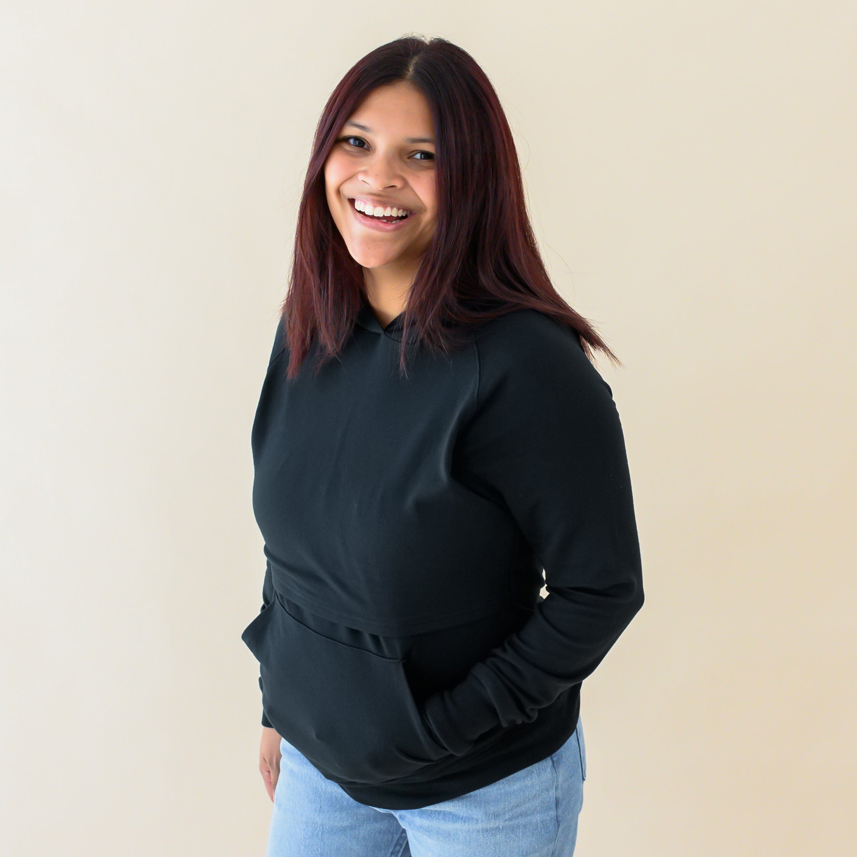 Woman wearing Kyte Baby Women's French Terry Bamboo Nursing Hoodie with Kangaroo Pocket in Midnight