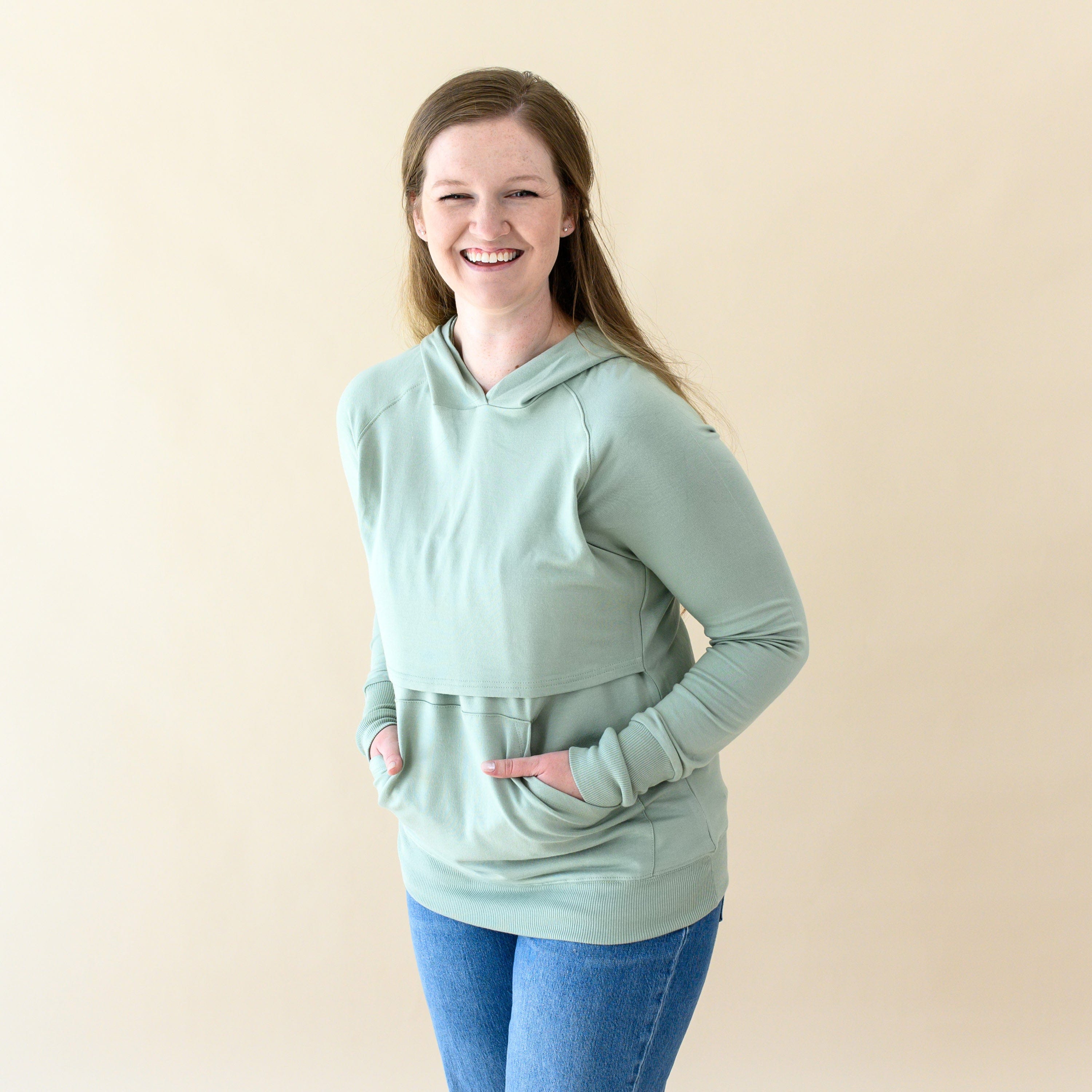Woman wearing Kyte Baby Women's French Terry Nursing Hoodie in Thyme