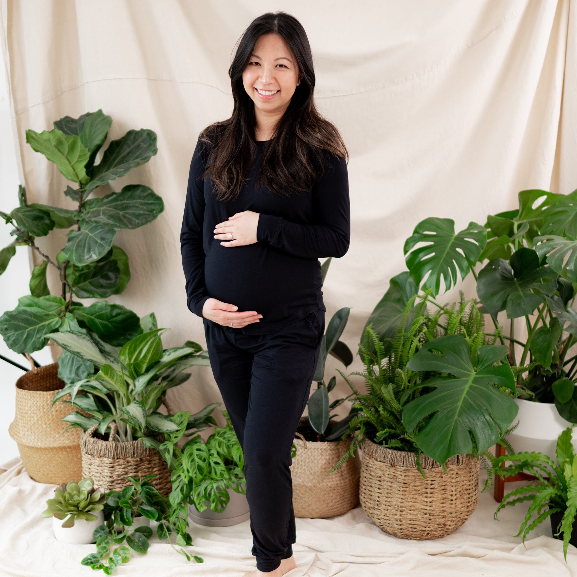 Woman wearing Women's jogger pregnancy pajamas in Midnight black