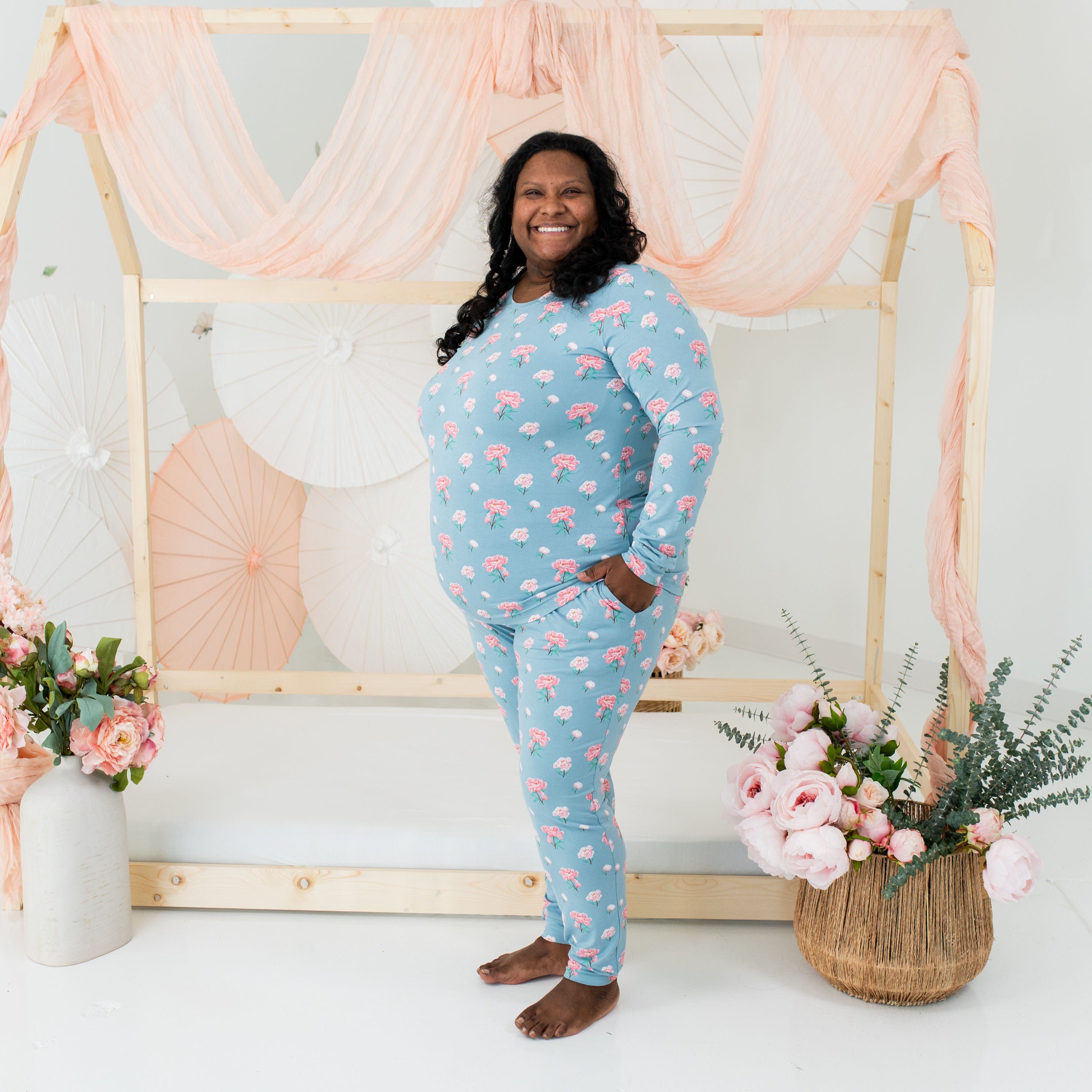 Woman wearing Kyte Baby women's jogger pajama set in Peony
