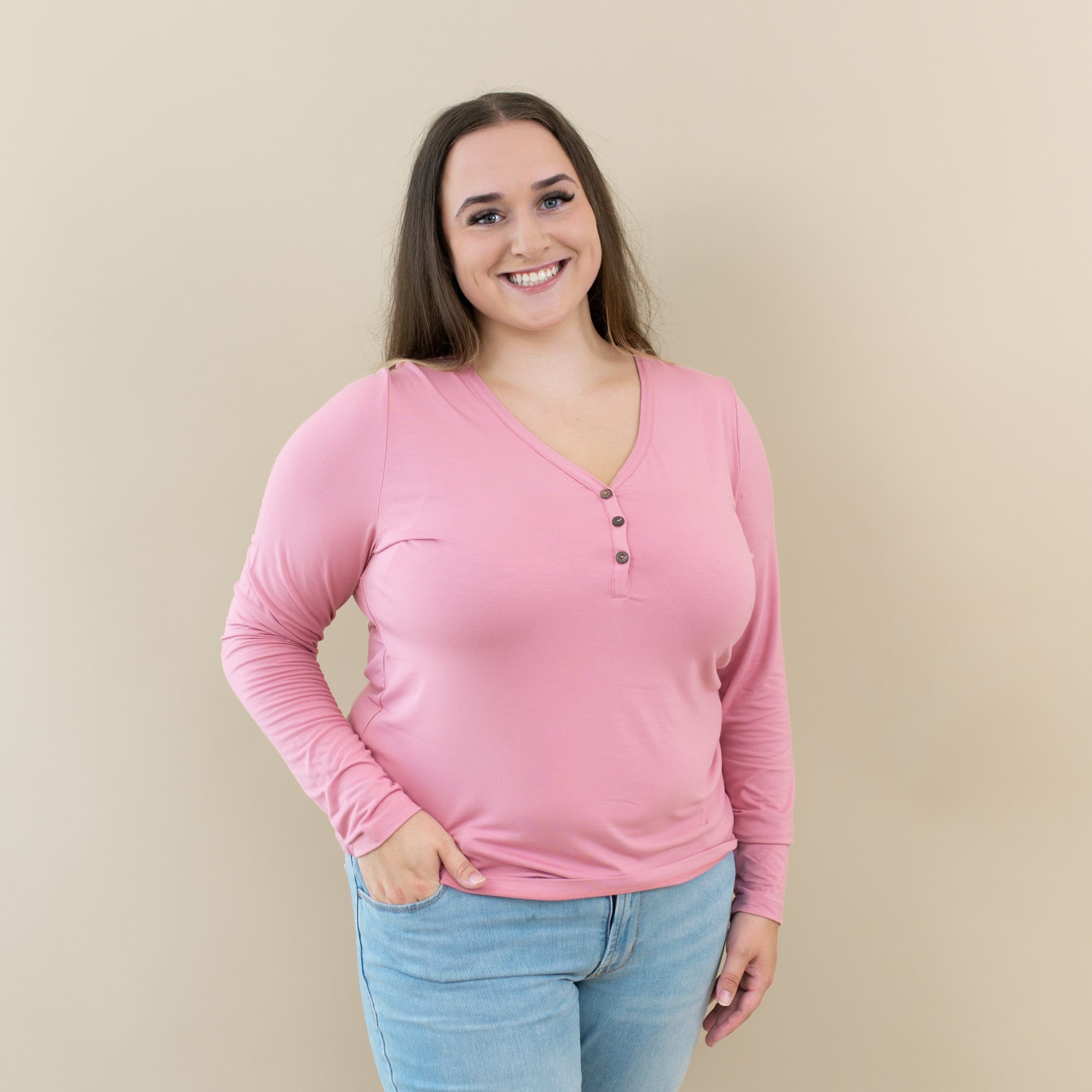 Woman wearing Kyte Baby Women's Long Sleeve Henley Tee in Apple Blossom