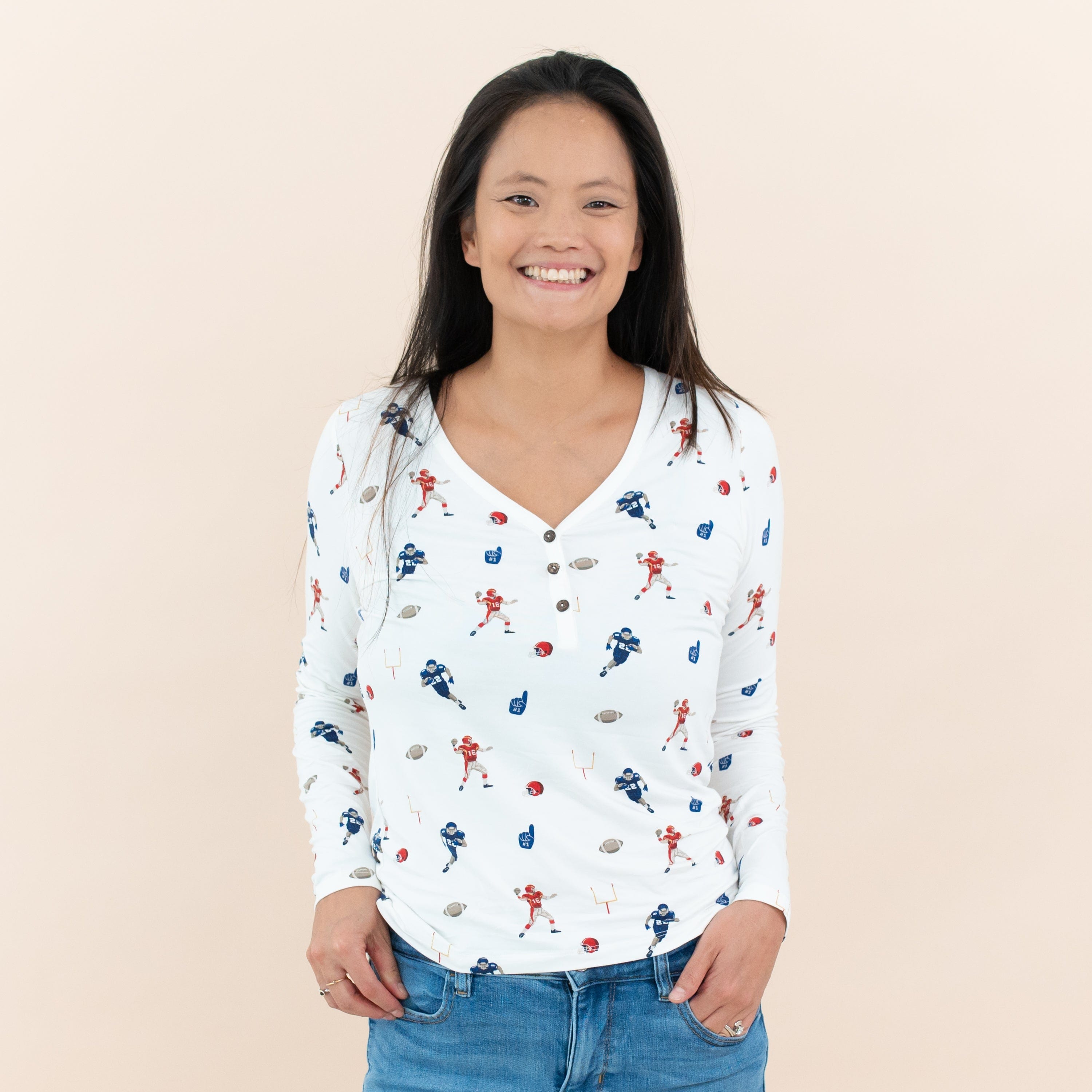 Woman wearing Kyte Baby Women's Long Sleeve Henley Tee in Football