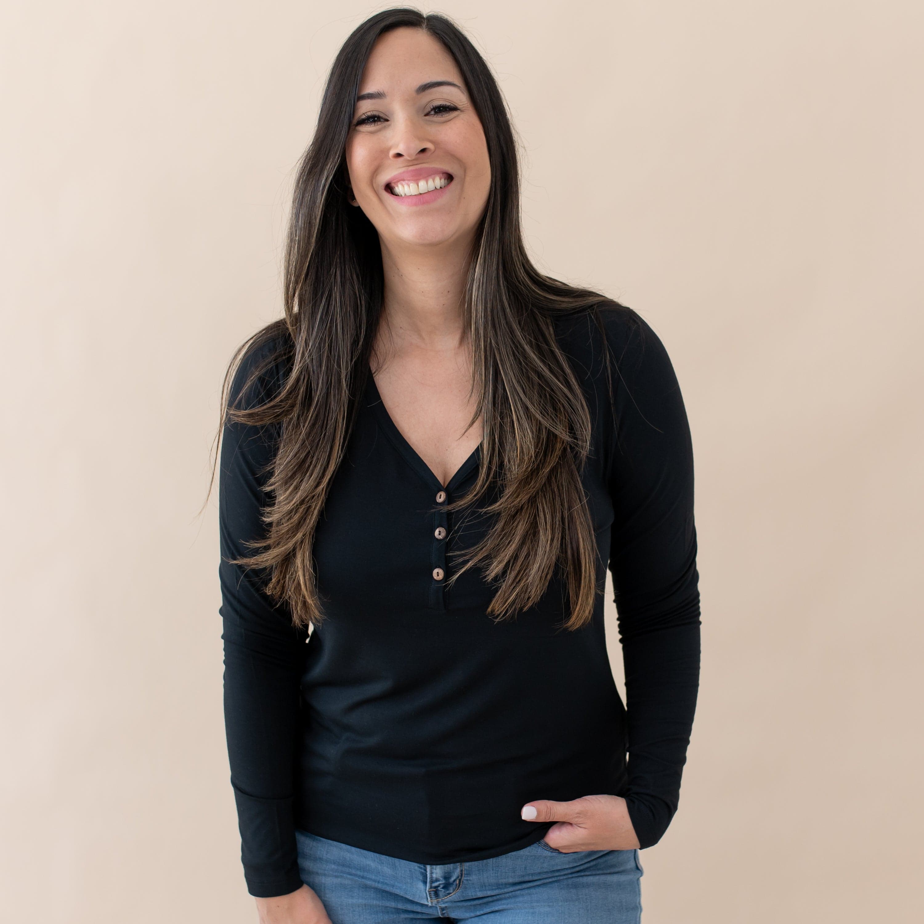 Woman wearing Kyte Baby Women's Bamboo Long Sleeve Henley Tee in Midnight