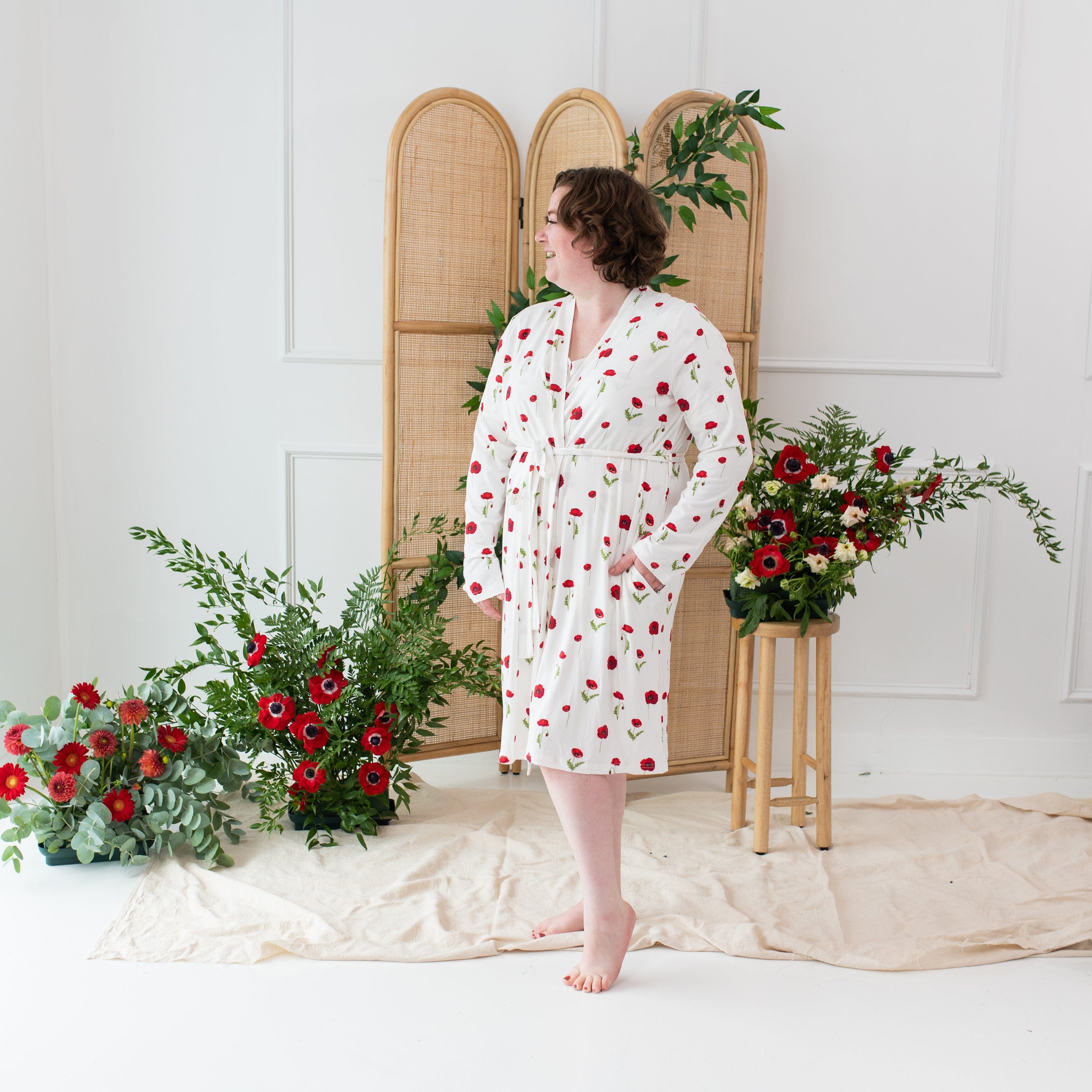 Woman wearing Kyte Baby Women’s Lounge Robe in Cloud Poppies