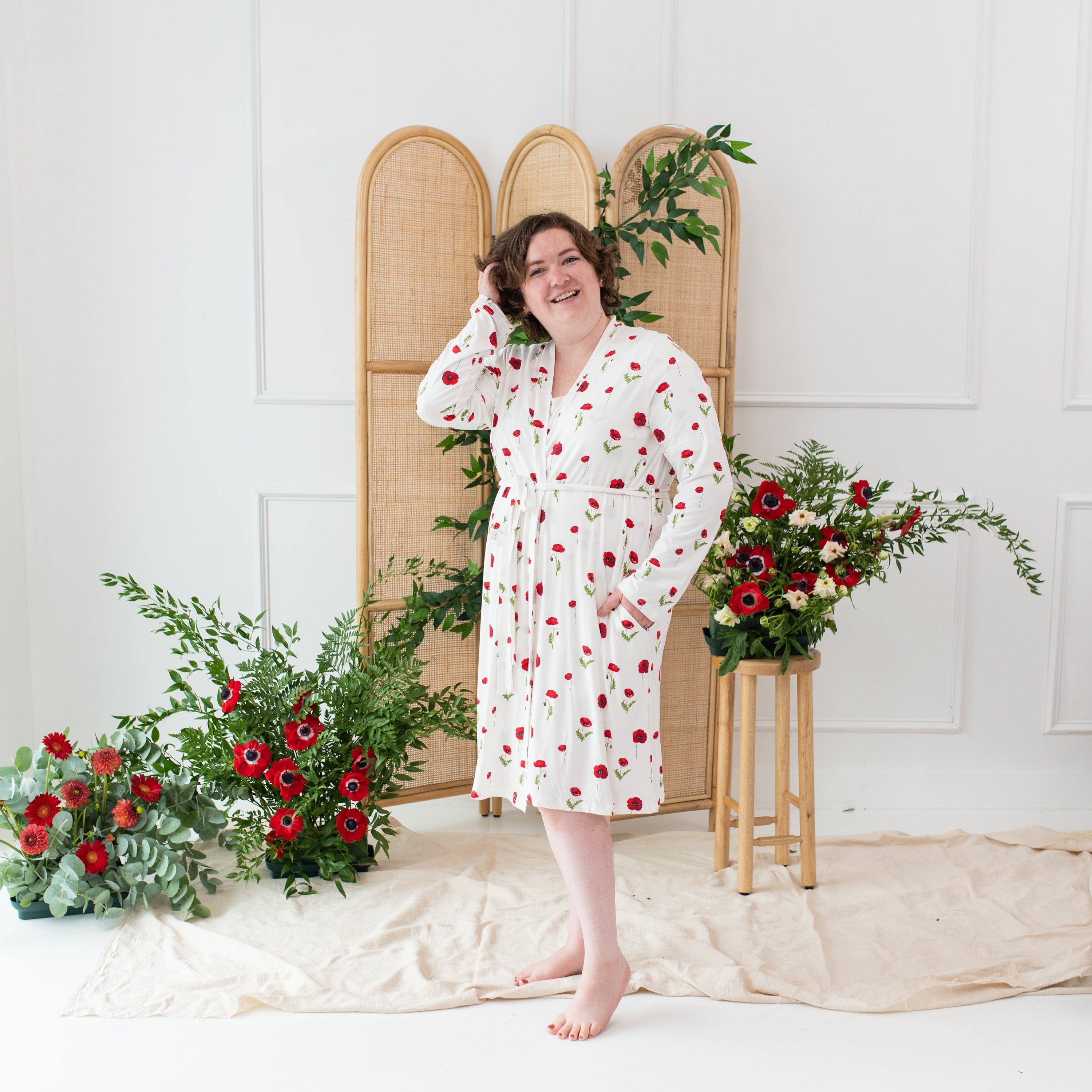 Woman wearing Kyte Baby Women’s bamboo Lounge Robe in Cloud Poppies