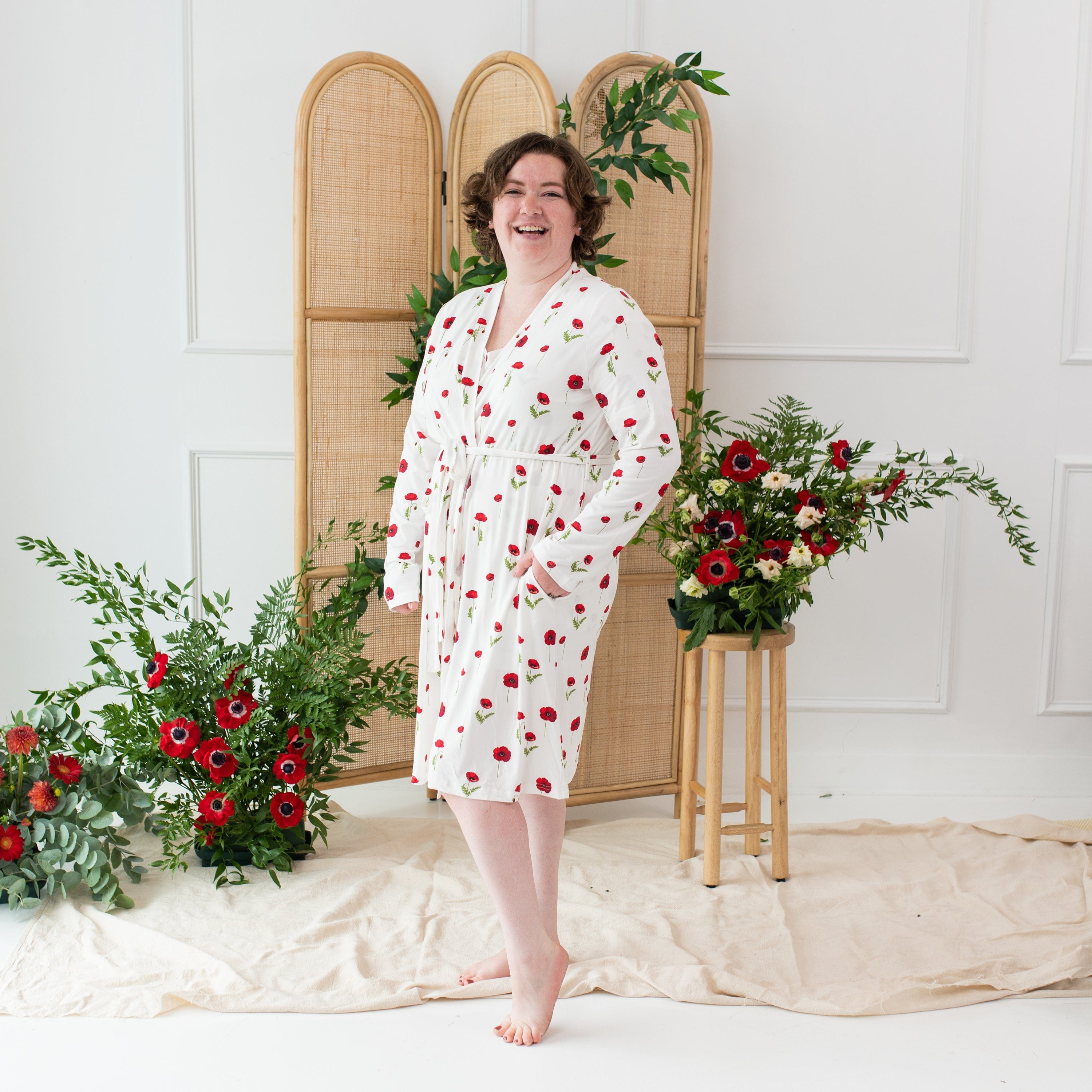 Woman wearing Kyte Baby Women’s Lounge Robe with 3/4 hem in Cloud Poppies