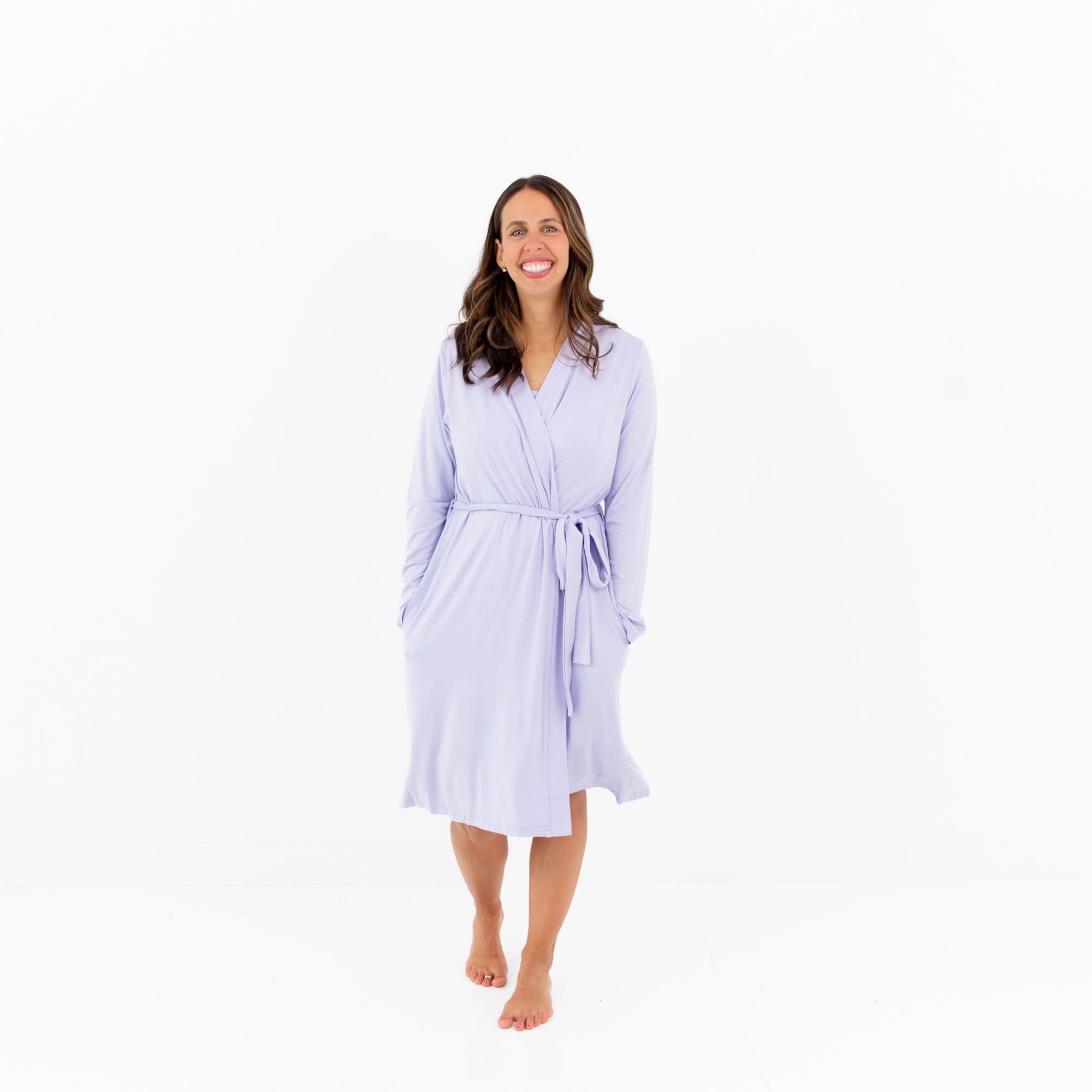 Woman wearing Kyte Baby Women’s Lounge Robe with 3/4 hem in Lilac
