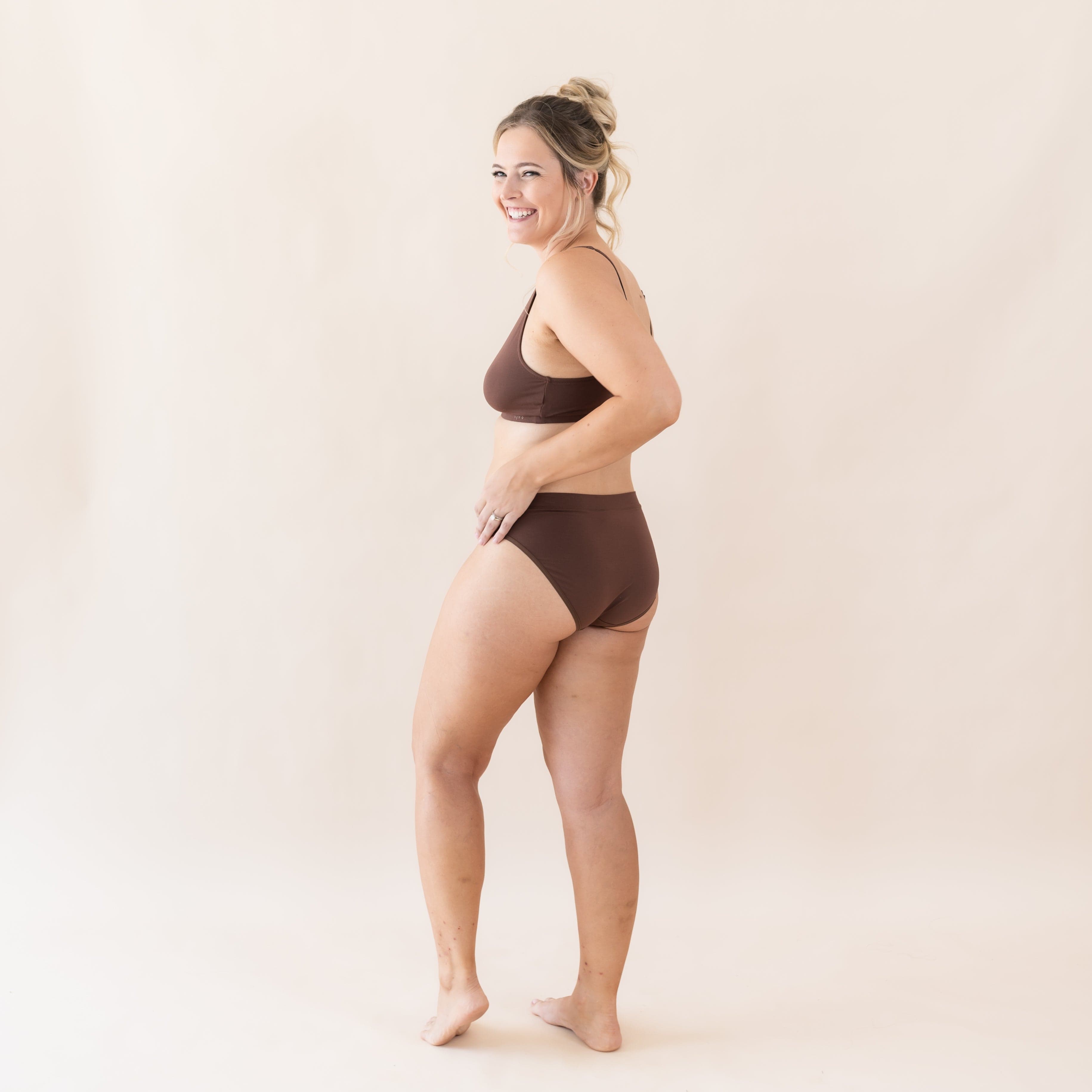 Woman wearing Kyte Baby Women's Midi Brief in Toffee