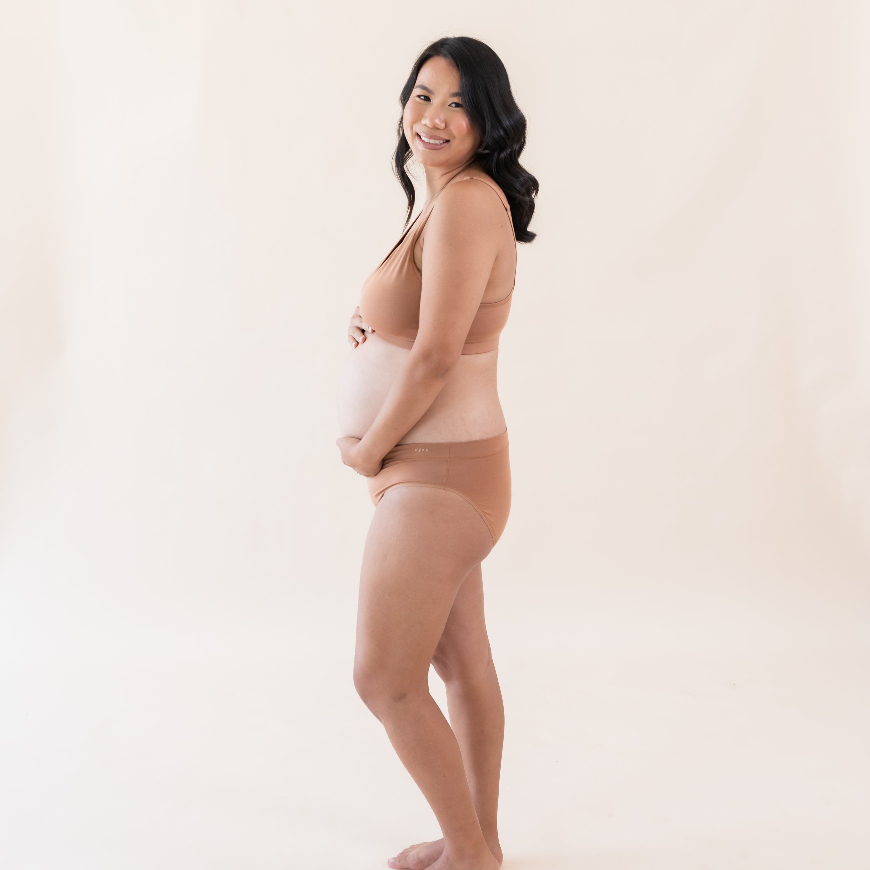 Woman wearing Kyte Baby Women's Midi Brief in Latte