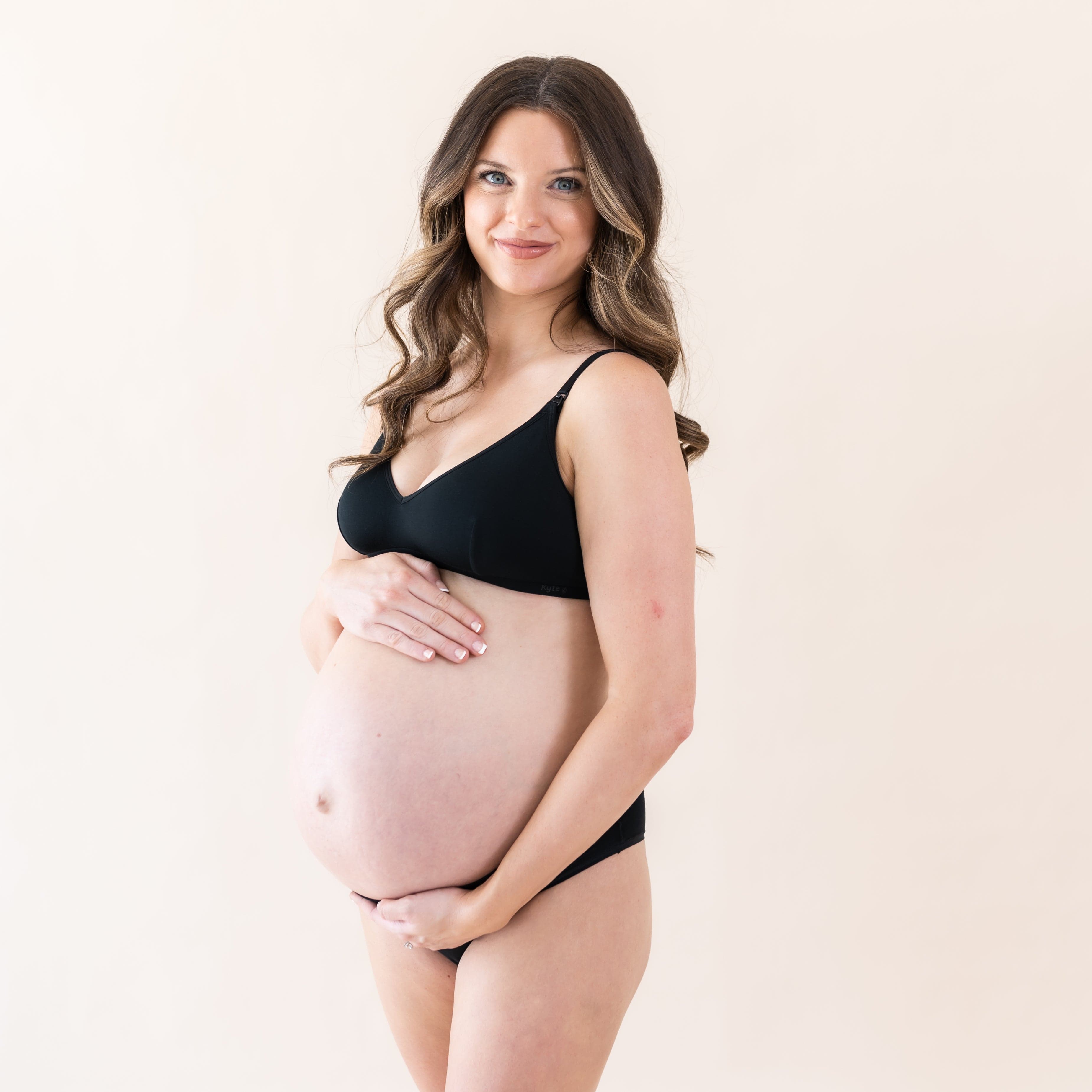 Woman wearing Kyte Baby Women's Nursing Bra with adjustable straps in Midnight black