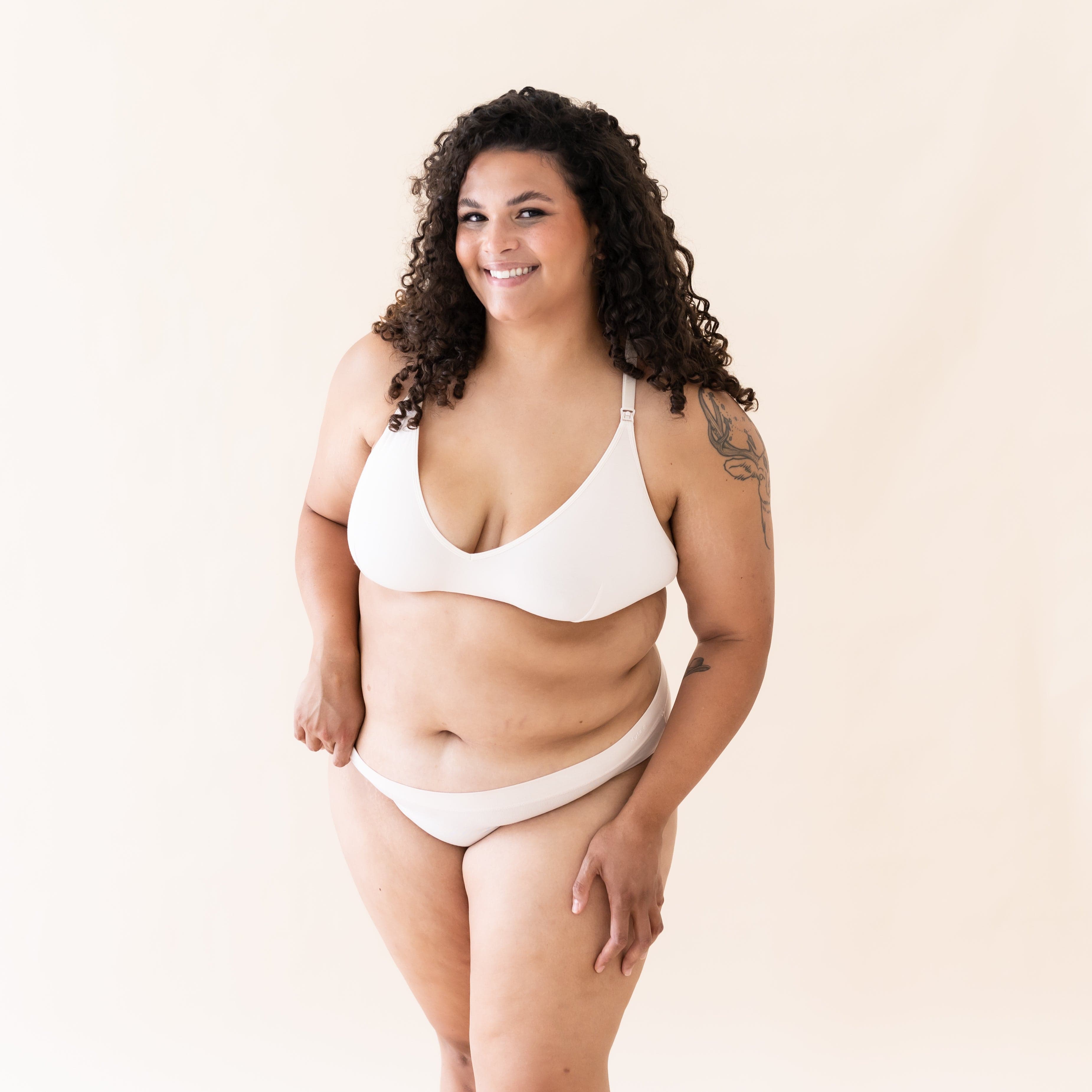 Woman wearing Kyte Baby Women's Nursing Bra with adjustable straps in Blonde