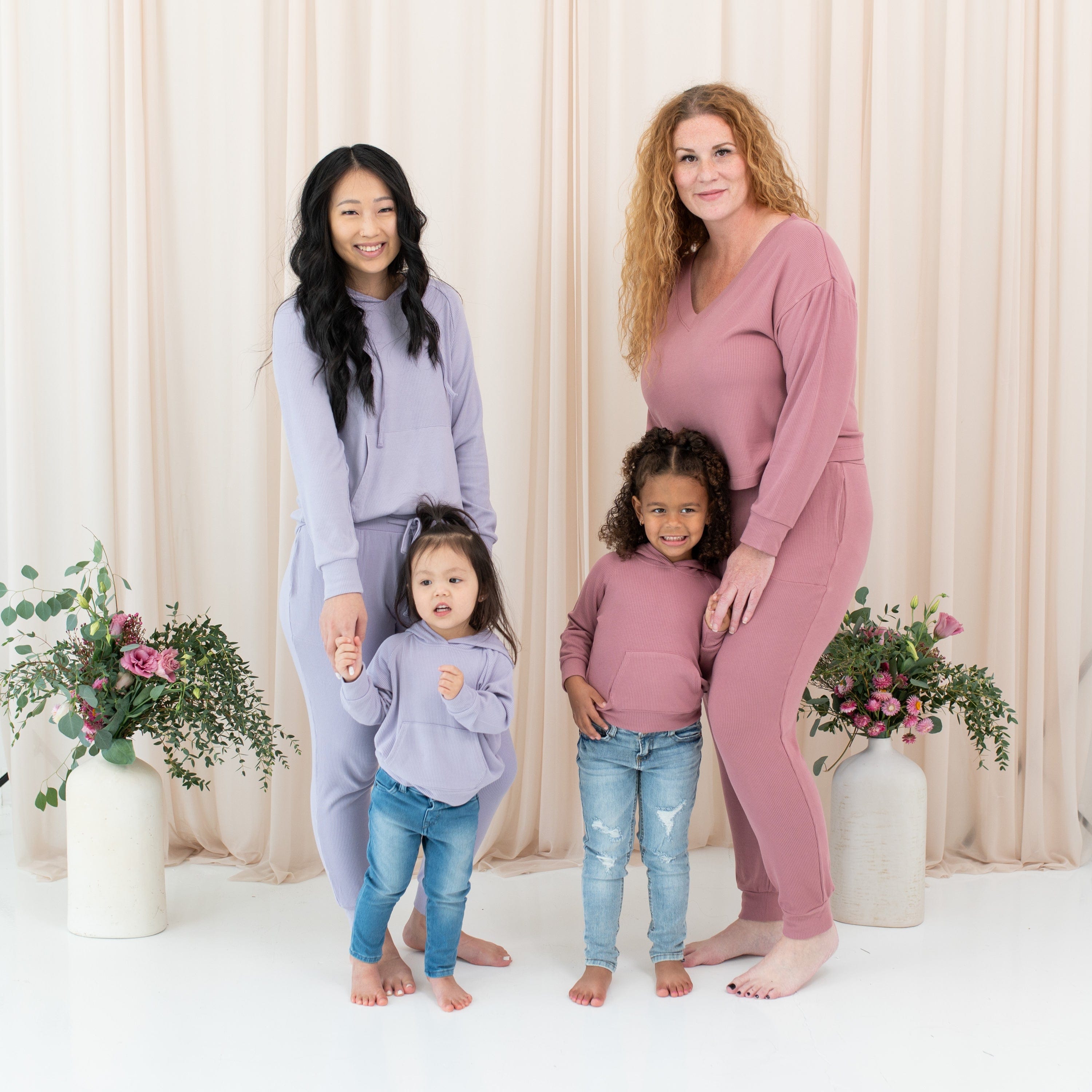 Models wearing Mommy and Me coordinating Kyte Baby Ribbed Hoodies