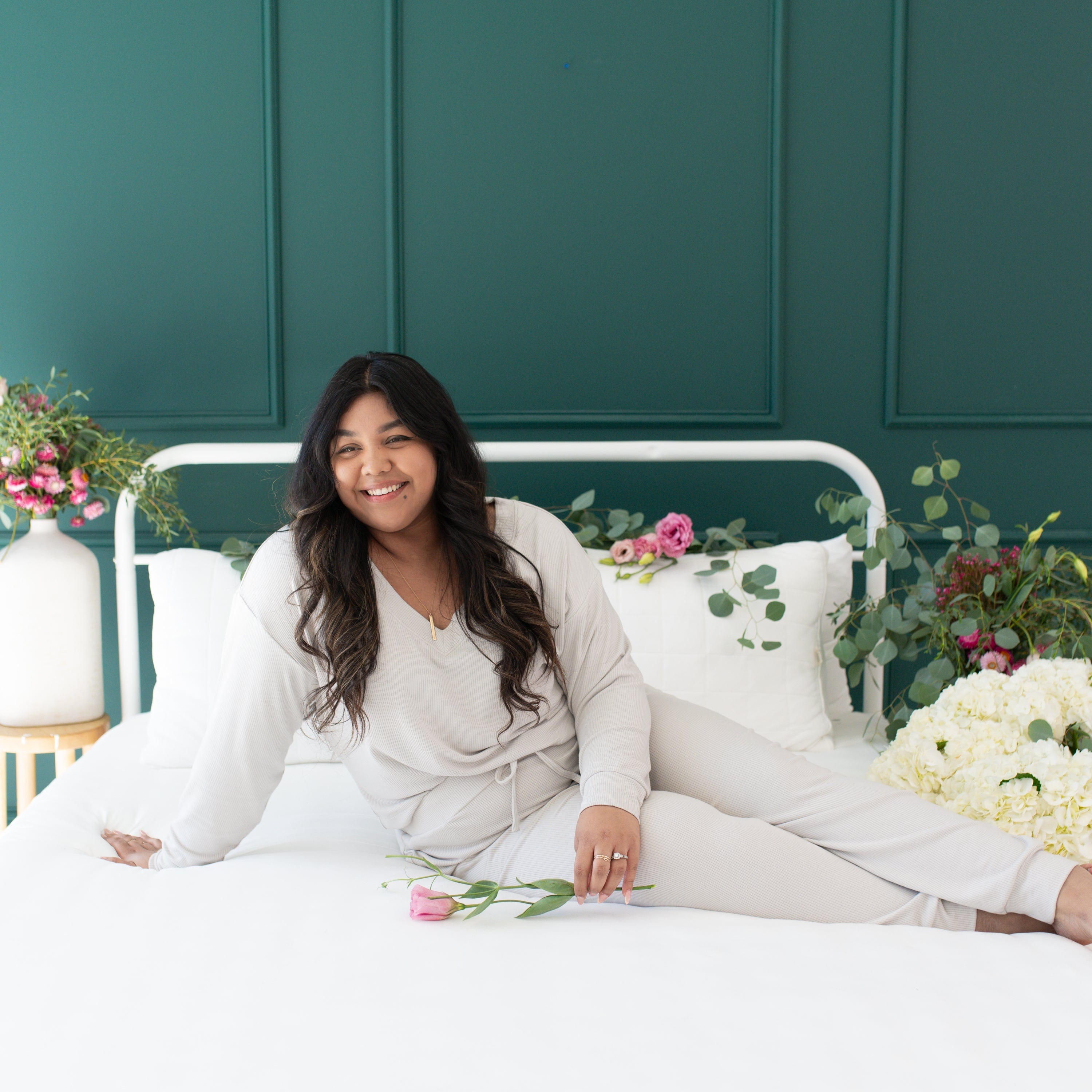 Woman wearing Kyte Baby Relaxed Fit Ribbed Long Sleeve Crop Top shirt in Oat