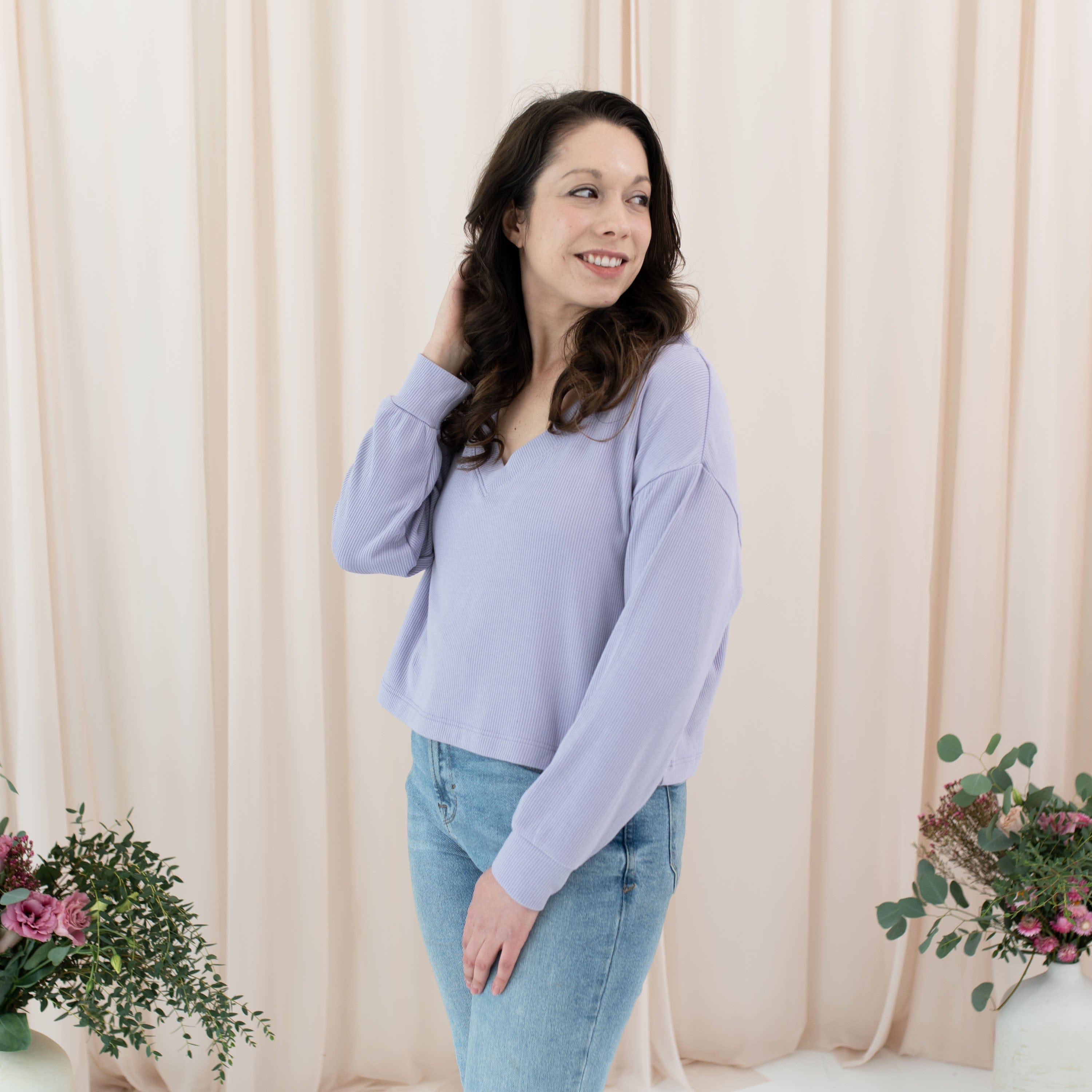 Woman wearing Kyte Baby relaxed fit Ribbed Long Sleeve Crop Top in Taro purple