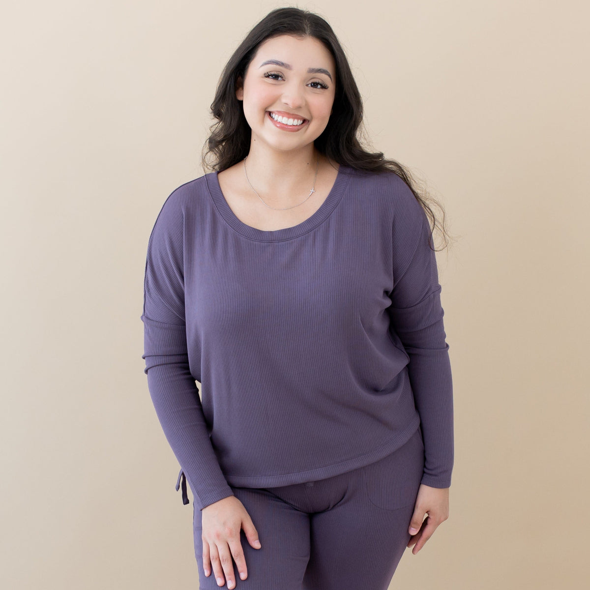 Woman wearing Kyte Baby Women's Ribbed Long Sleeve Drop Shoulder Top in Currant