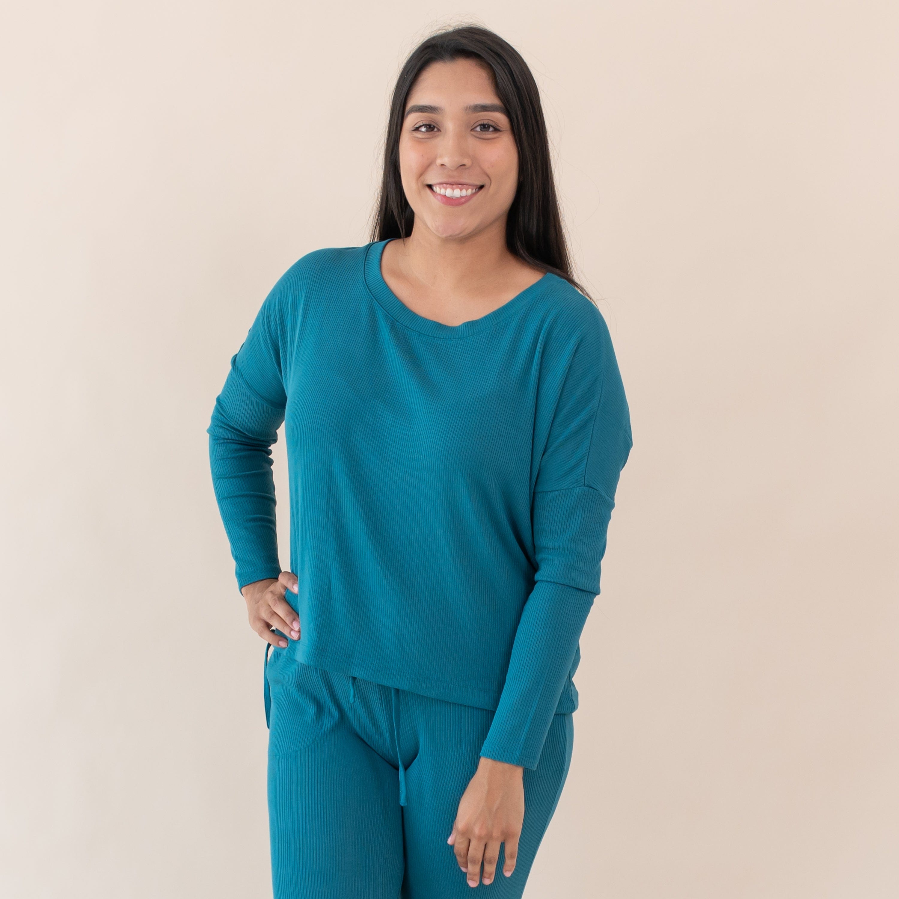 Woman wearing Kyte Baby Women's Ribbed Long Sleeve Drop Shoulder Top in Loch