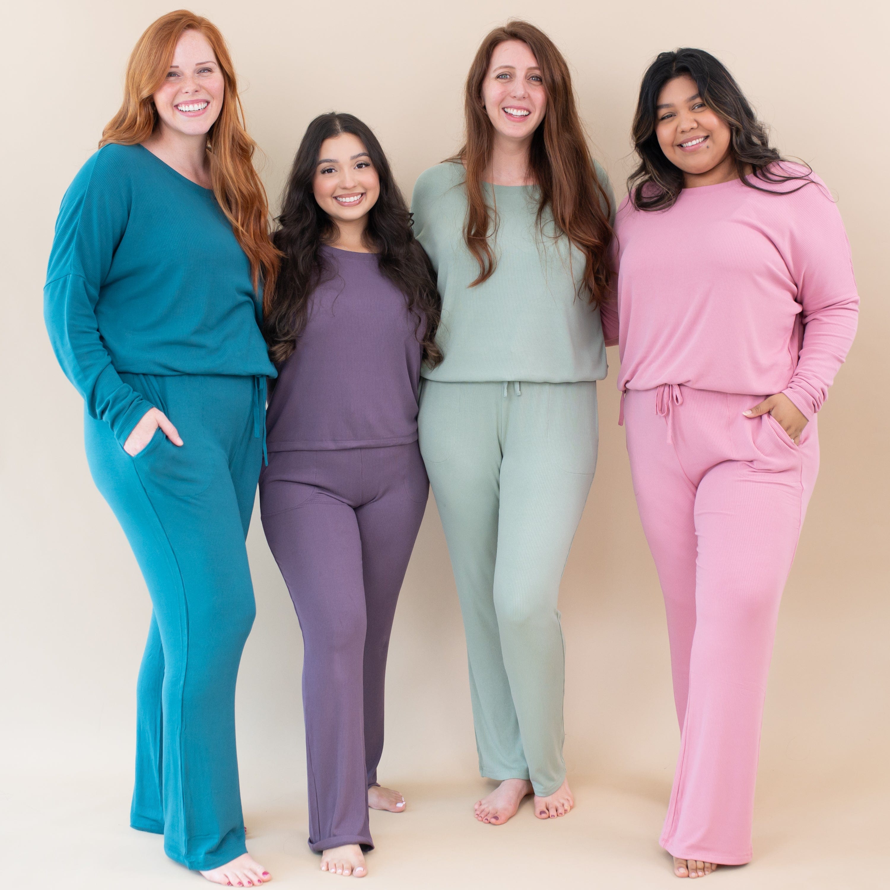 Women wearing Kyte Baby Women's Ribbed Long Sleeve Drop Shoulder Tops and Wide Leg Pants with pockets