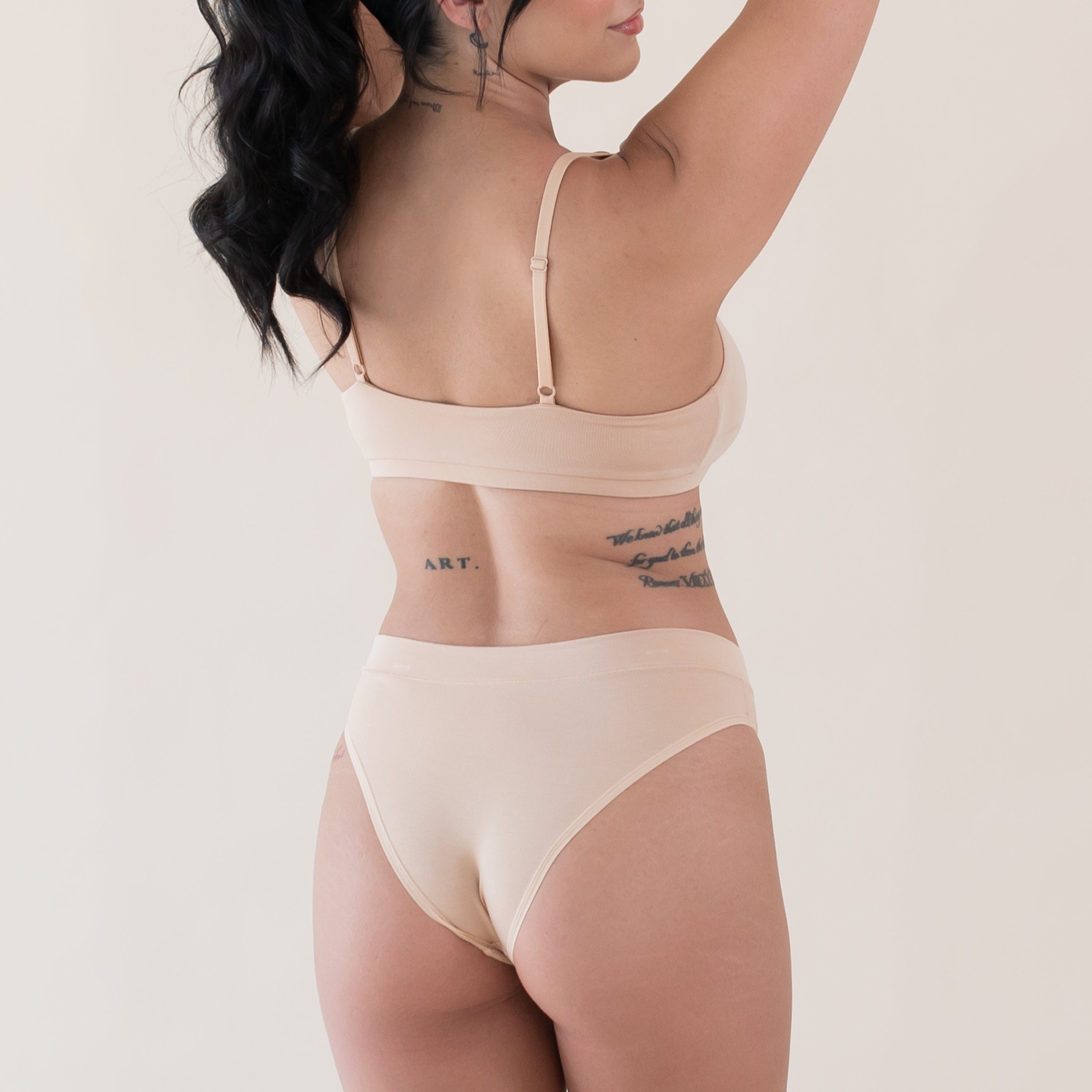 Woman wearing Kyte Baby Women's Scoop Neck Bralette and Underwear in Chai