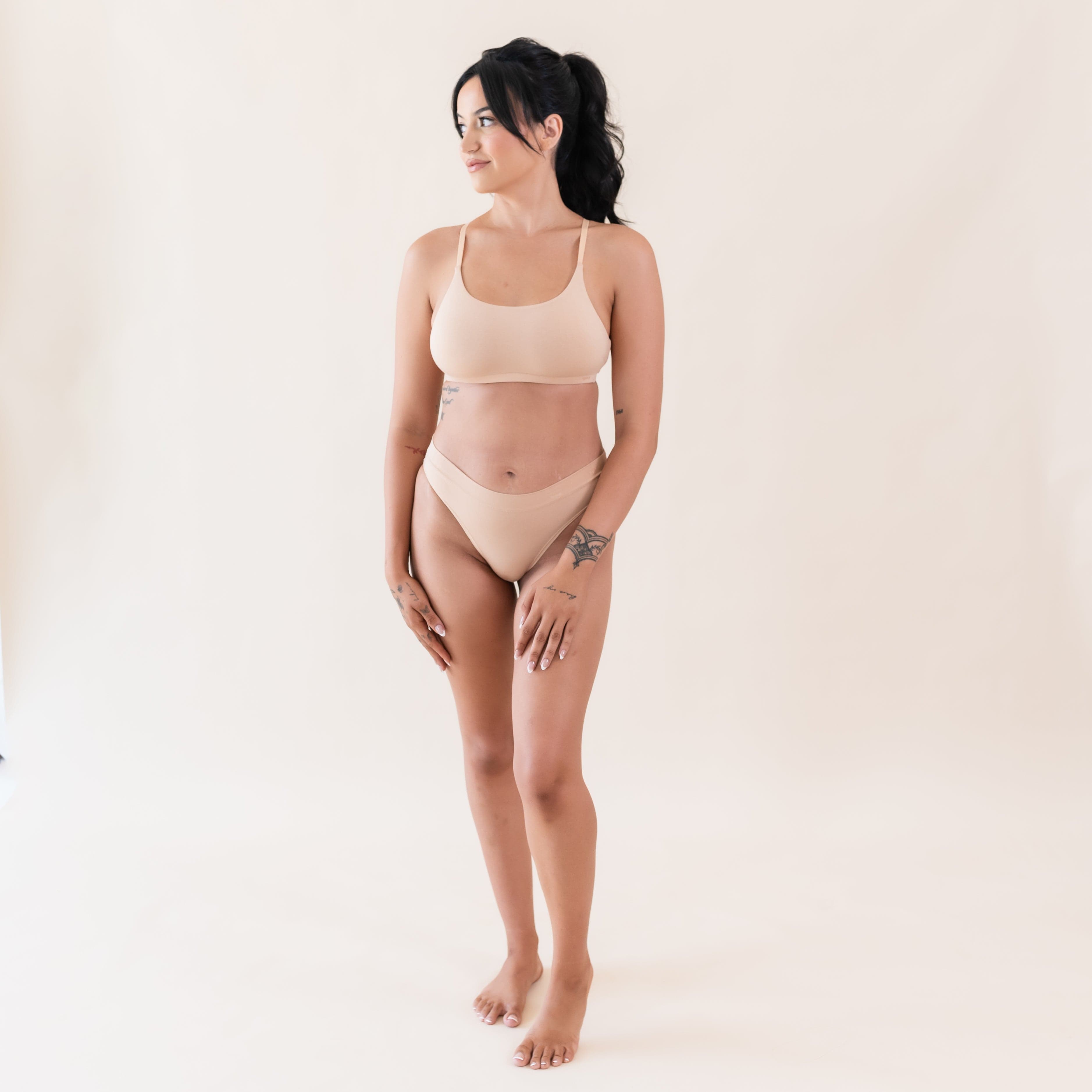 Woman wearing Kyte Baby Women's Scoop Neck Bralette in Chai