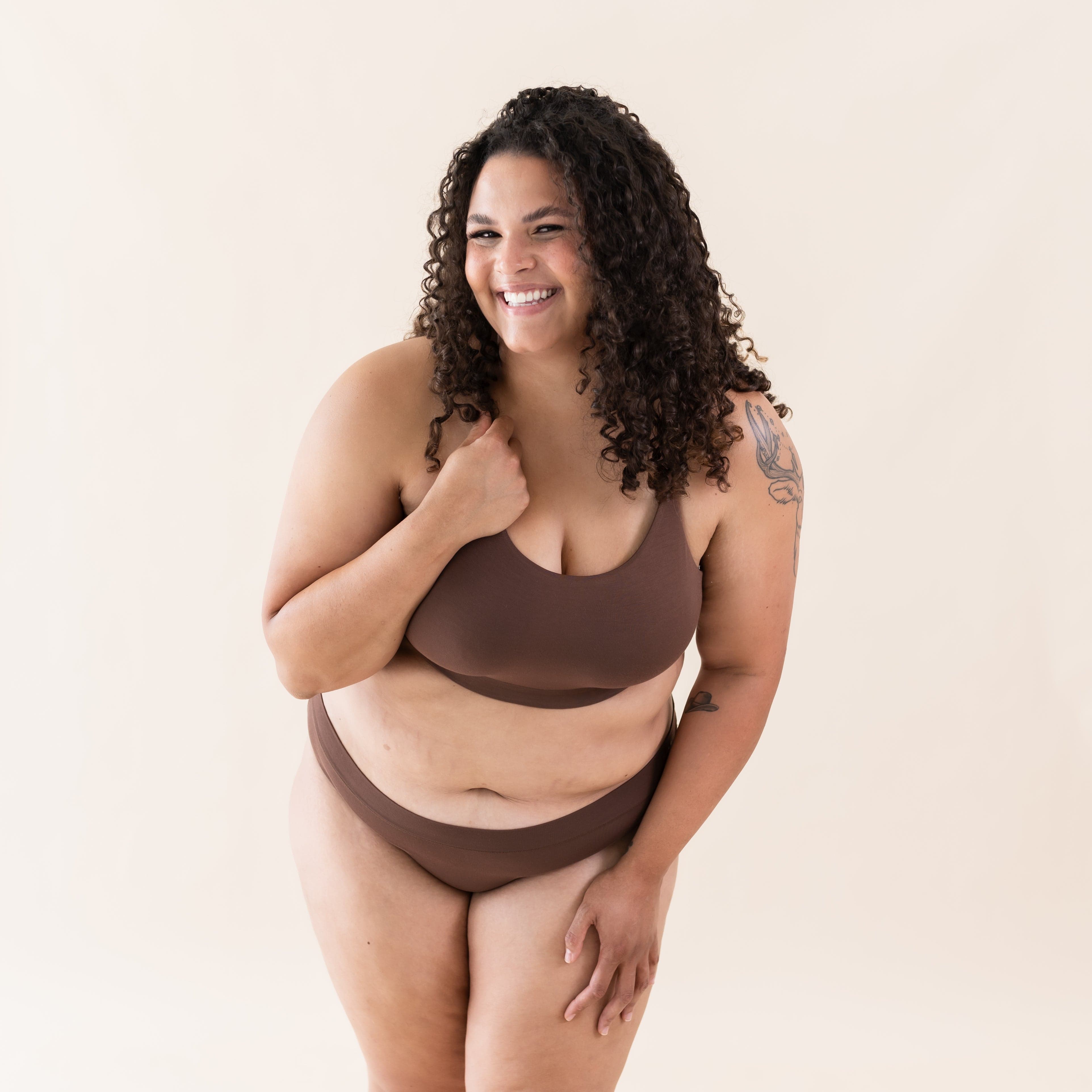 Woman wearing Kyte Baby Women's Scoop Neck Wireless Bra in Toffee