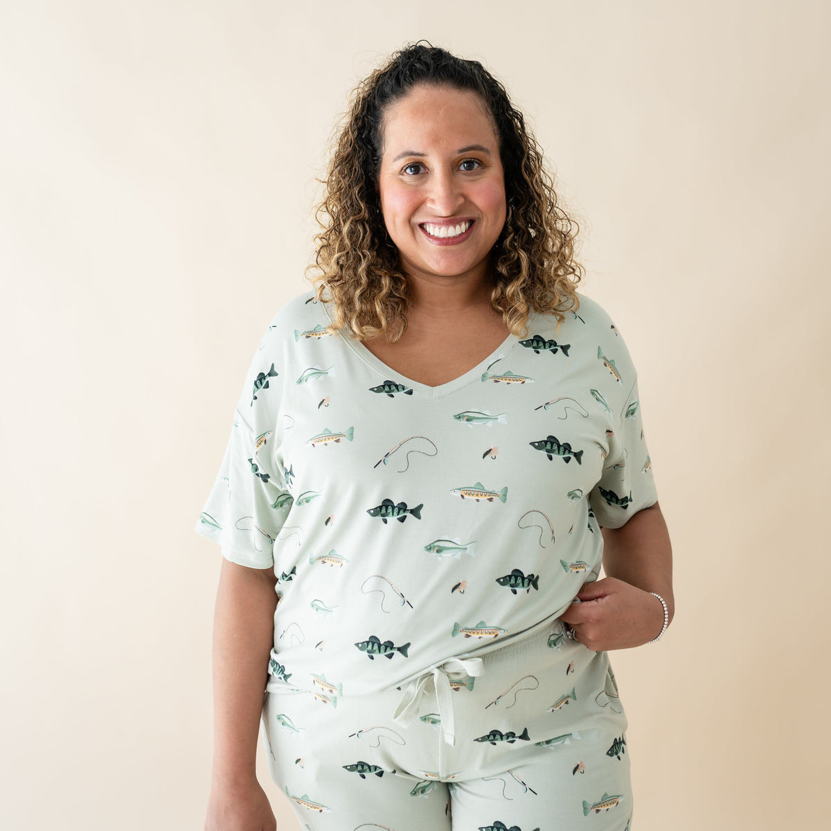 Woman wearing Kyte Baby Women's Relaxed Fit V-Neck in Fishing