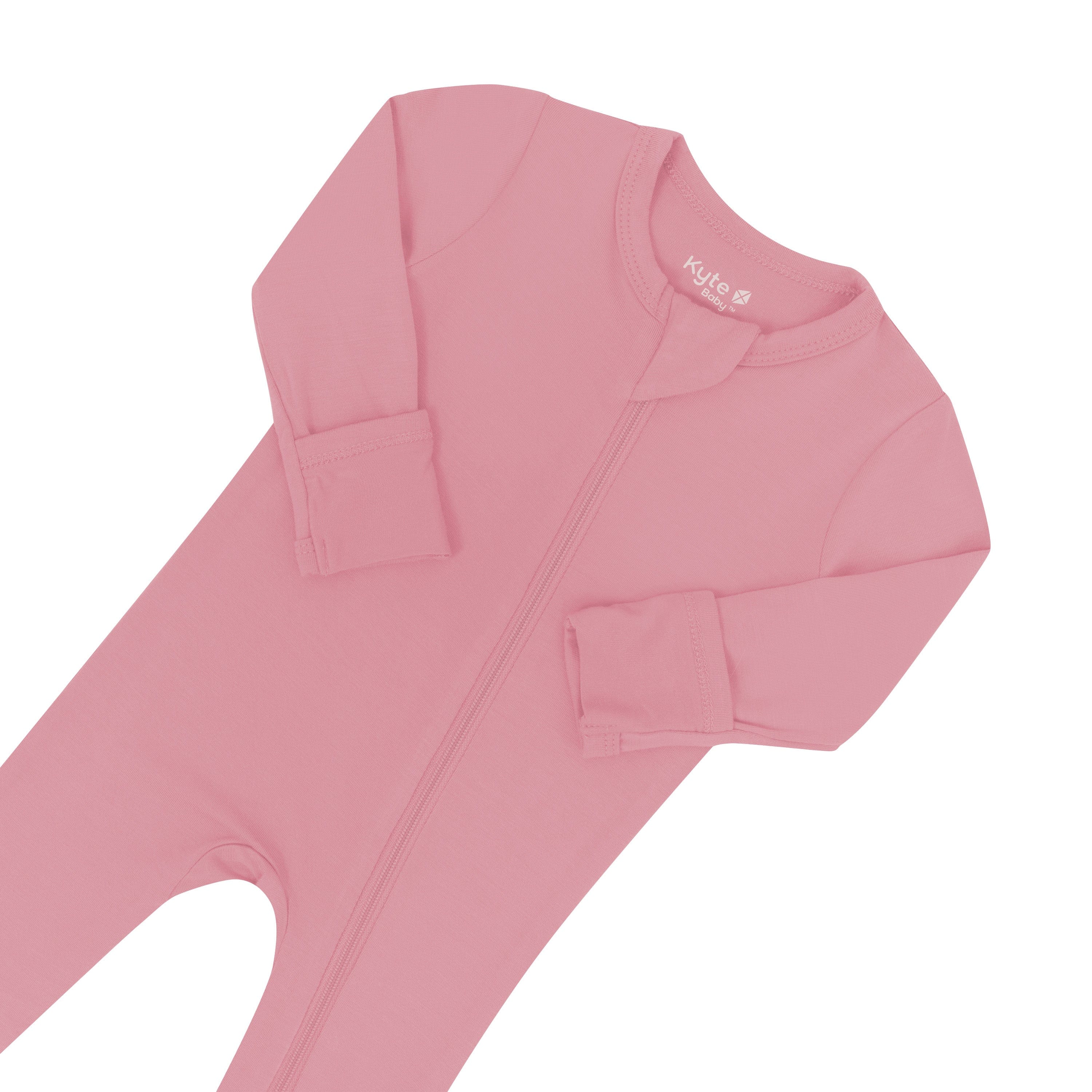 Zipper garage and fold over cuffs on Kyte Baby Zippered Footie pajamas in Apple Blossom