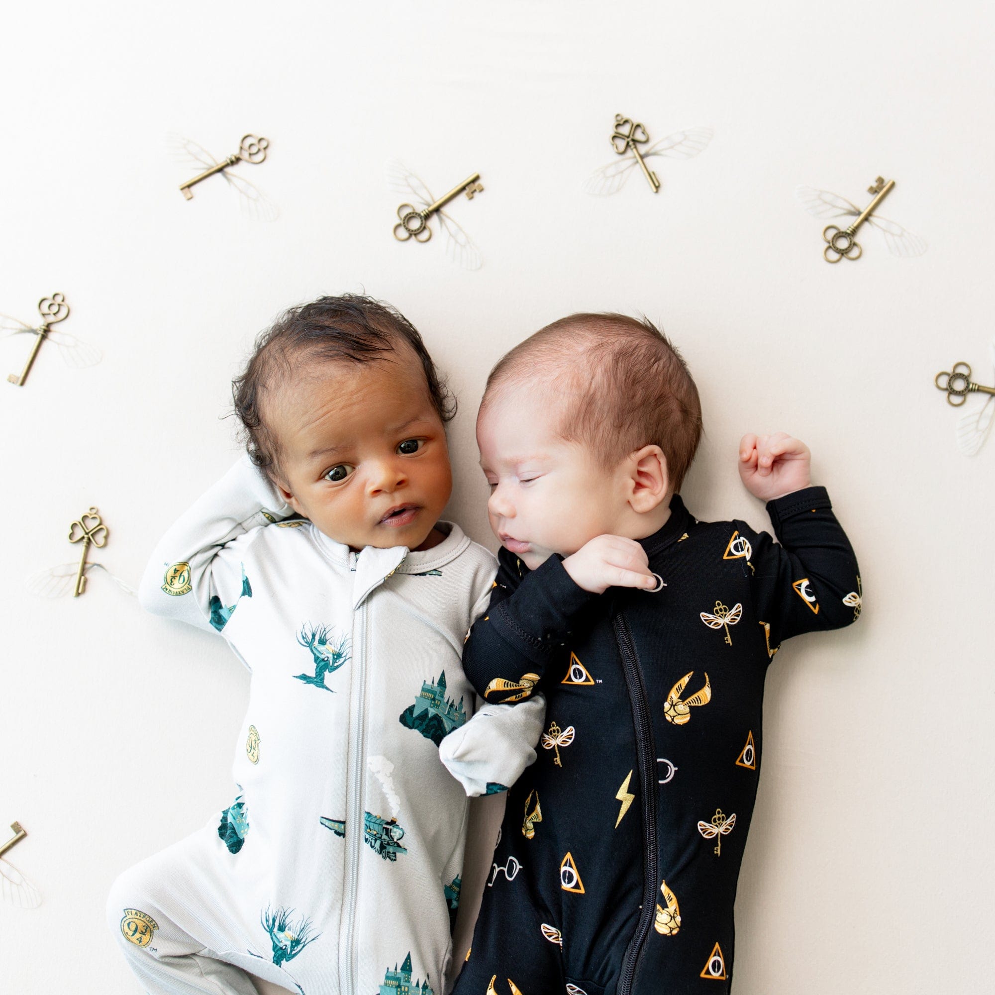 Newborns wearing Zippered Footies in Journey and Midnight Icon Harry Potter Pajamas
