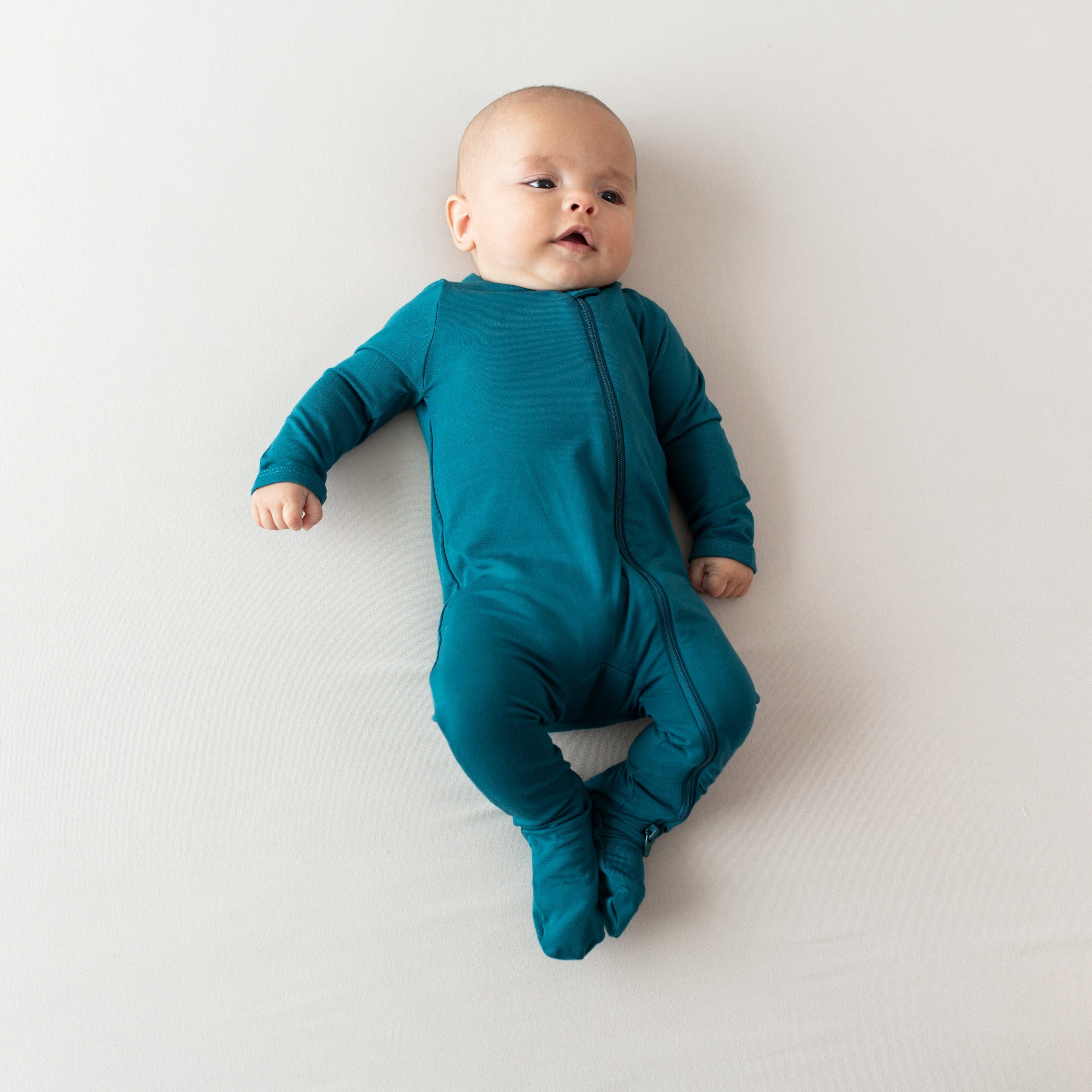 Baby wearing the Zippered dark blue Footie kids pajamas
