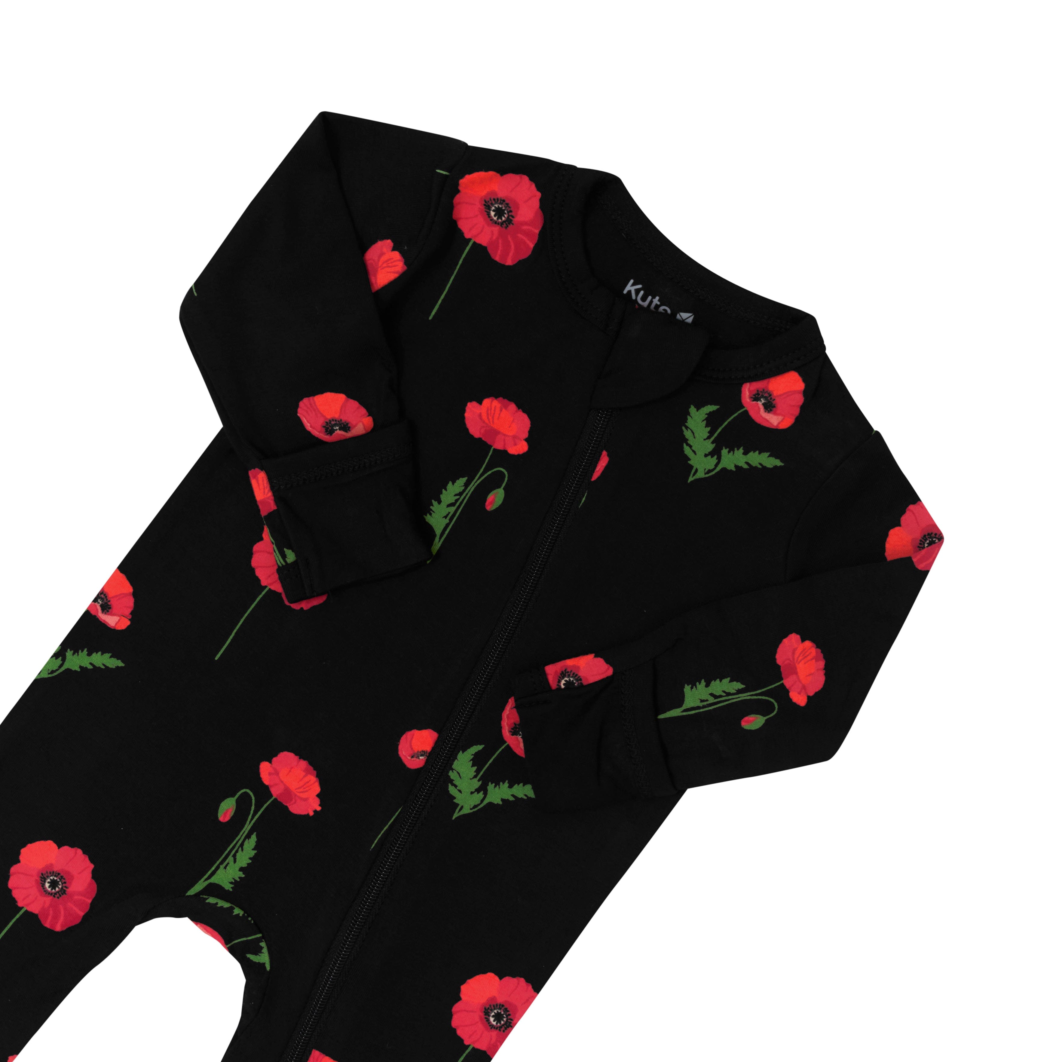 Zipper garage and fold over cuffs on Kyte Baby Zippered Footie in Midnight Poppies