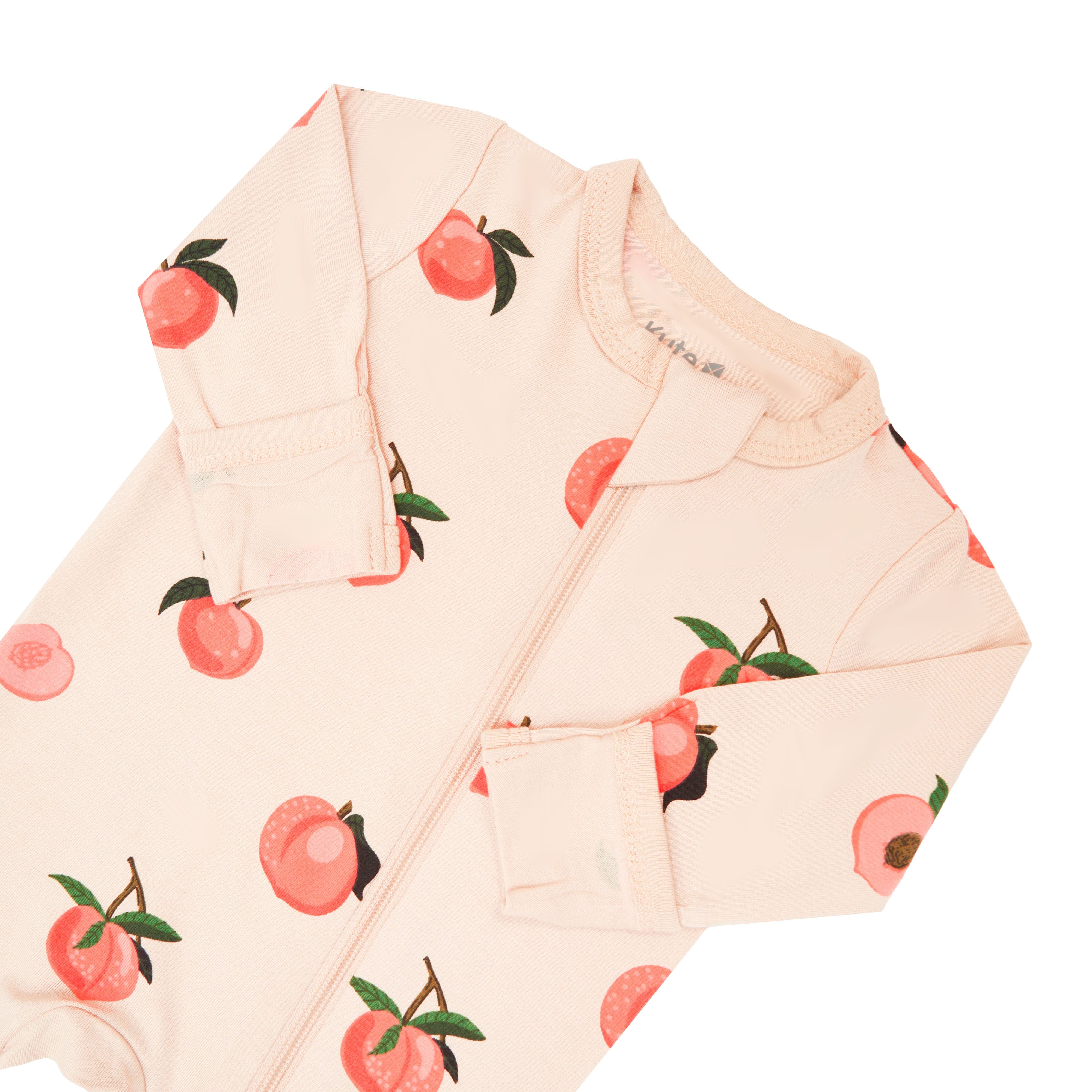 Zipper garage and fold over cuffs on Kyte Baby Zippered Footie in Peach