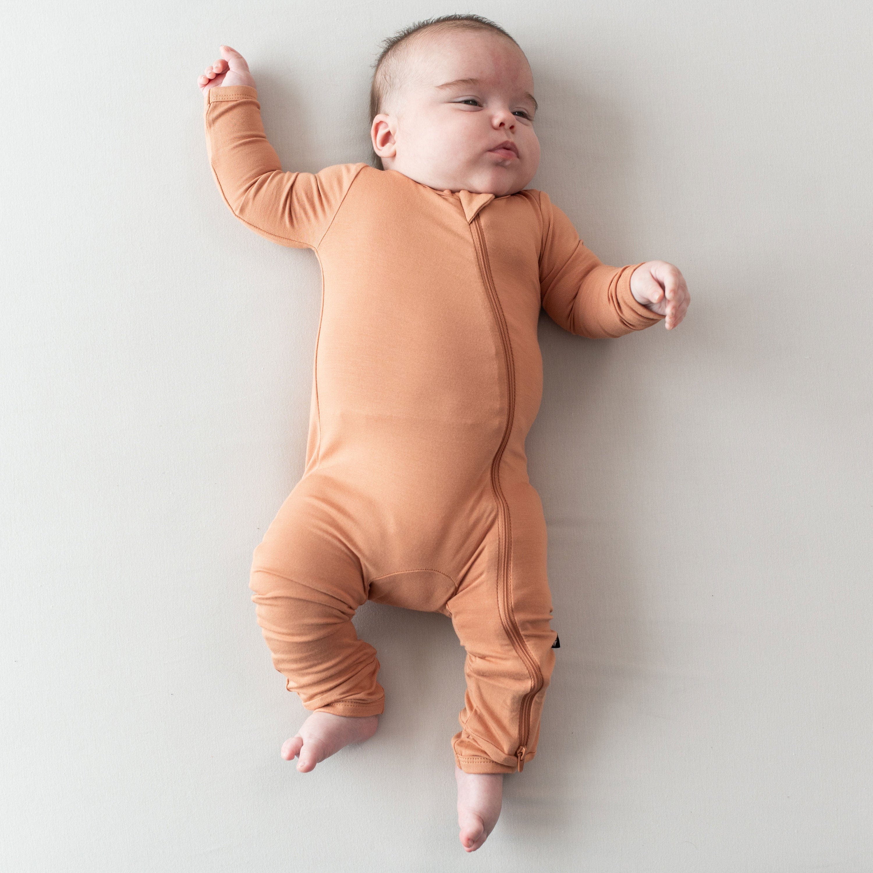 Kyte Baby Zippered Rompers Zippered Romper in Apricot