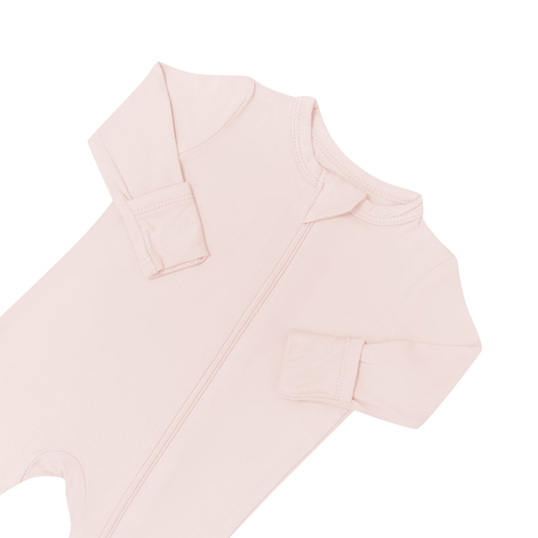 Zipper garage and fold over cuffs on Kyte Baby bamboo Zippered Romper in Blush